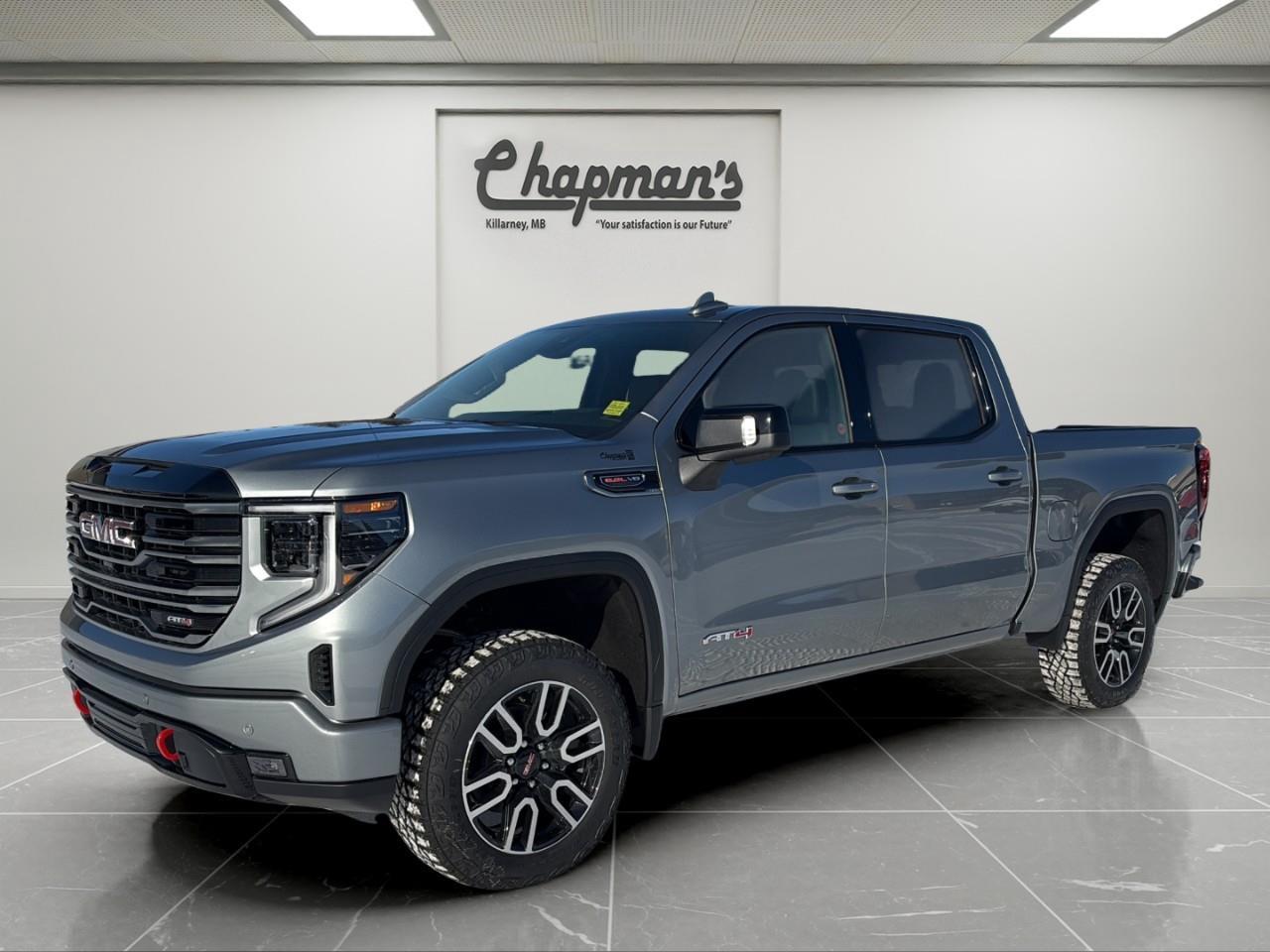 <p>The 2026 GMC Sierra 1500 AT4 Crew Cab 4WD blends premium refinement with serious off-road capability and V8 performance. Finished in <strong>Sterling Metallic</strong> with a <strong>Jet Black and Kalahari interior</strong>, this AT4 is powered by the commanding <strong>6.2L Ecotec3 V8</strong> paired with a <strong>10-speed automatic transmission</strong>, delivering strong acceleration, confident towing capability, and unmistakable presence.</p><p>Equipped with the <strong>AT4 Premium Package</strong> and <strong>Technology Package</strong>, this Sierra raises the bar for both comfort and innovation.</p><h3><strong>Performance & Capability</strong></h3><p>Engineered for rugged terrain and heavy-duty demands.</p><ul><li><p>6.2L Ecotec3 V8 Engine</p></li><li><p>10-Speed Automatic Transmission</p></li><li><p>2-Speed Autotrac Transfer Case</p></li><li><p>Automatic Locking Rear Differential</p></li><li><p>AT4 Off-Road Suspension with 2" Factory Lift</p></li><li><p>Monotube Shocks and Skid Plates</p></li><li><p>Hill Descent Control</p></li><li><p>Trailer Brake Controller</p></li><li><p>120V Power Outlet in Cargo Bed & Instrument Panel</p></li><li><p>Active Exhaust System</p></li></ul><h3><strong>Interior Comfort & Convenience</strong></h3><p>Premium materials meet practical durability in the AT4 cabin.</p><ul><li><p>Heated & Ventilated Front Bucket Seats</p></li><li><p>Heated Second-Row Outboard Seats</p></li><li><p>10-Way Power Front Seats</p></li><li><p>Driver Seat & Mirror Memory</p></li><li><p>Heated Wrapped Steering Wheel</p></li><li><p>Power Tilt & Telescoping Steering Column</p></li><li><p>Adaptive Cruise Control</p></li><li><p>Wireless Charging</p></li><li><p>Bose Premium Sound System</p></li><li><p>Premium Floor Liners</p></li><li><p>Power Sunroof</p></li><li><p>Rear Sliding Power Window</p></li><li><p>Universal Home Remote</p></li></ul><h3><strong>Technology & Connectivity</strong></h3><p>Advanced displays and camera systems keep you informed and in control.</p><ul><li><p>13.4" GMC Premium Infotainment Touchscreen with Google Built-In</p></li><li><p>Wireless Apple CarPlay & Android Auto</p></li><li><p>12.3" Digital Driver Information Centre</p></li><li><p>In-Vehicle Trailering App</p></li><li><p>15" Multicolor Head-Up Display</p></li><li><p>Rear Camera Mirror</p></li><li><p>Bed View Camera</p></li><li><p>OnStar Basics (Up to 8 Years)</p></li><li><p>SiriusXM Audio</p></li></ul><h3><strong>Safety & Driver Assistance</strong></h3><p>Comprehensive GMC Pro Safety technologies provide confidence on and off the road.</p><ul><li><p>Automatic Emergency Braking</p></li><li><p>Forward Collision Alert</p></li><li><p>Front Pedestrian Braking</p></li><li><p>Lane Keep Assist with Lane Departure Warning</p></li><li><p>IntelliBeam Automatic High Beams</p></li><li><p>Front & Rear Park Assist</p></li><li><p>Trailer Side Blind Zone Alert</p></li><li><p>Rear Cross Traffic Braking</p></li><li><p>Rear Pedestrian Alert</p></li><li><p>HD Surround Vision</p></li><li><p>Safety Alert Seat</p></li><li><p>Teen Driver Mode</p></li><li><p>Tire Pressure Monitoring with Tire Fill Alert</p></li></ul><h3><strong>Exterior Highlights</strong></h3><p>Bold AT4 styling with functional trail-ready details.</p><ul><li><p>20" Machined Aluminum Wheels with Carbon Grey Accents</p></li><li><p>Goodyear Wrangler Territory MT Tires</p></li><li><p>Spray-On Bedliner</p></li><li><p>GMC MultiPro Tailgate</p></li><li><p>LED Cargo Area Lighting</p></li><li><p>Power Folding & Heated Mirrors with Driver-Side Auto-Dimming</p></li><li><p>LED Headlamps, Tail Lamps & Fog Lamps</p></li><li><p>Rain-Sensing Wipers</p></li><li><p>Rear Window Defogger</p></li></ul><p>With commanding V8 performance, factory lift suspension, premium interior features, and advanced technology packages, this 2026 Sierra AT4 delivers capability and refinement in equal measure.</p><p>2 Year/24,000 kilometer* Complimentary Oil Changes (2 total)</p><p>3 Year/60,000 kilometer* Base Warranty Coverage</p><p>5 Year/100,000 kilometer* Powertrain Component Warranty Coverage</p><p>5 Year/100,000 kilometer* Courtesy Transportation and 24/7 Roadside Assistance</p><p>6 Year/160,000 kilometer* Sheet Metal (Rust Through) Perforation Warranty Coverage</p><p>*Whichever Comes First.</p><p>Price Includes HD Flaps & 6 Tube Steps.</p><p>Price Includes Dealer Fee.</p><p>Price Excludes PST & GST.</p><p>Financing Options Available, Call For More Details.</p> <p><strong>*While every reasonable effort is made to ensure the accuracy of this information, we are not responsible for any error or omissions contained on these pages. Please verify any information in question with Chapman Motors Ltd.</strong></p>
