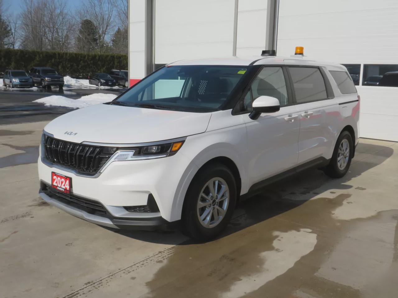 2024 Kia Carnival LX (**RARE!!**GREAT WORK VAN!!**CUSTOM SHELVING UNIT INSTALLED INSIDE!!**ORANGE BECON LIGHT ON ROOF!!**LOW KM!!**ALLOY RIMS**DIGITAL TOUCHSCREEN**REVERSE CAMERA**LANE ASSIST**USB/AUX**ELECTRIC PARKING BRAKE**CRUISE CONTROL**BLUETOOTH**) Photo