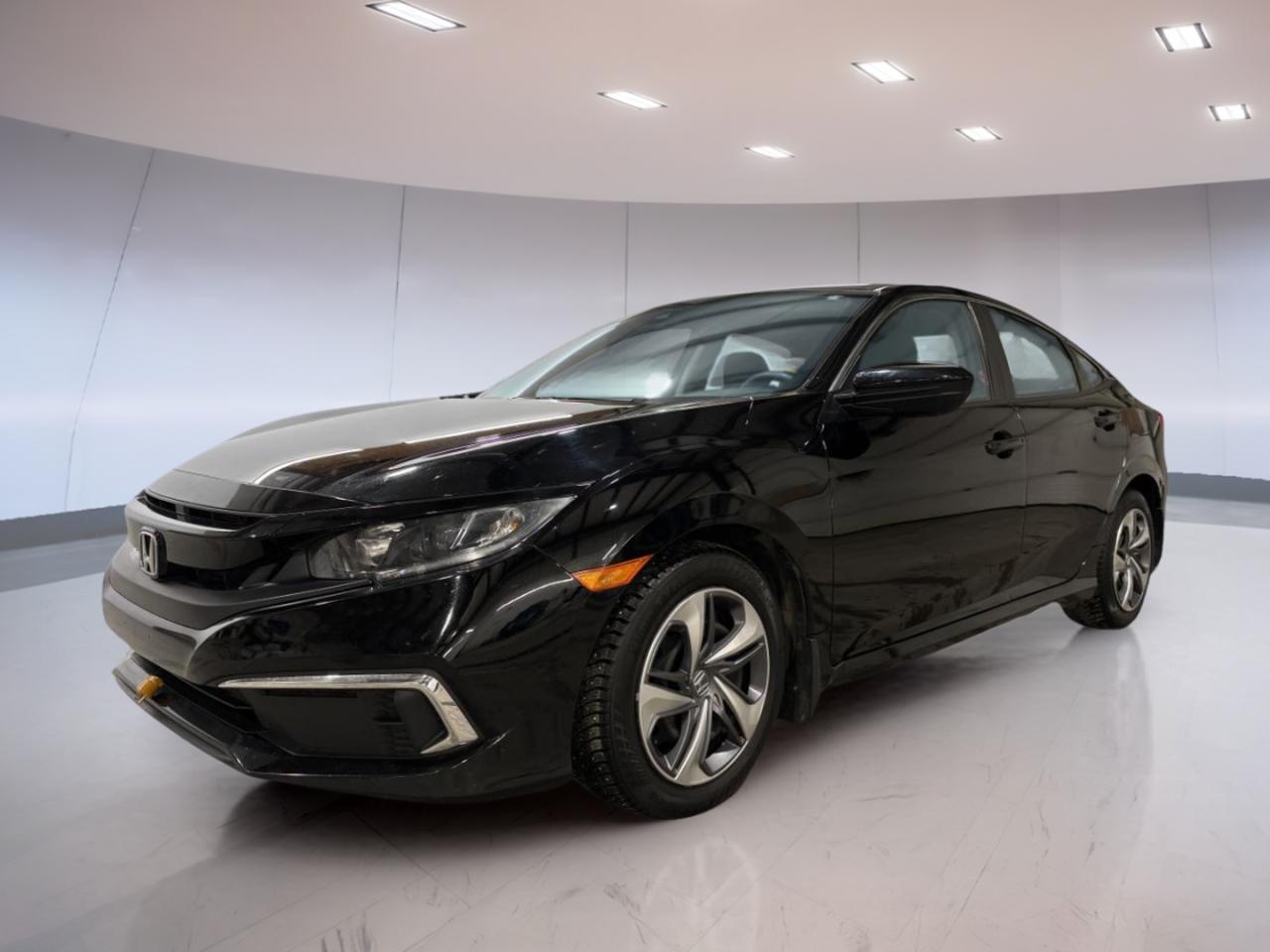 In Moose Jaw, a used 2020 Honda Civic Sedan A is a smart choice for drivers who want proven Honda reliability in a clean, easy-to-drive package. Finished in Black with a Black interior, this sedan keeps a sharp, classic look that suits daily commuting and weekend plans alike. With 74,590 km and an automatic transmission, its ready for many more kilometres of confident driving from Moose Jaw Honda.

The 2020 Honda Civic Sedan A is known for its balanced feel on the road. Its easy to place in traffic, simple to park, and comfortable for longer drives across Saskatchewan. If you want a sedan that fits real life and stays easy to own, this Civic delivers the kind of value that keeps it popular year after year.

ADVANCED SAFETY FEATURES  
»» Designed for predictable, stable everyday handling  
»» Clear outward visibility for confident lane placement  
»» Solid braking feel for daily driving  
»» Built for dependable, consistent road manners  

PERFORMANCE AND EFFICIENCY  
»» Automatic transmission for smooth, simple driving  
»» Responsive acceleration for city and highway merges  
»» Balanced ride quality over rough pavement  
»» Practical sedan footprint for easy manoeuvres  

COMFORT AND CONVENIENCE  
»» Four-door layout for easy entry  
»» Comfortable cabin for daily commutes  
»» Simple controls that are easy to learn  
»» Sedan seating for passengers and errands  

TECHNONOLGY AND CONNECTIVITY  
»» Straightforward dash layout for quick access  
»» Easy-to-read displays for key information  
»» Convenient in-cabin controls within reach  
»» Designed for simple, distraction-reduced operation  

CARGO SPACE  
»» Trunk space for groceries and luggage  
»» Wide opening for easier loading  
»» Practical sedan storage for daily needs  
»» Room for sports gear and bags  

WHAT OTHER OWNERS LIKE  
»» Easy driving feel in busy traffic  
»» Honda reliability and long-term confidence  
»» Comfortable ride for daily commuting  
»» Practical size for parking anywhere  

This 2020 Honda Civic Sedan As VIN is: 2HGFC2F5XLH028261.