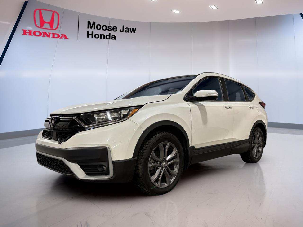 Meet a smart, practical SUV that fits life in Moose Jaw with ease. This used 2020 Honda CR-V Sport from Moose Jaw Honda blends everyday comfort with confident all-weather capability. Finished in White with a Black interior, it looks clean and modern while staying easy to maintain. With 73,902 km, it has already proven itself as a dependable choice for commuting, errands, and weekend plans.

This 2020 Honda CR-V Sport is powered by a 1.5 L 16-valve DOHC turbocharged 4-cylinder engine paired with a Continuously Variable Transmission (CVT). The result is smooth, quiet acceleration and relaxed cruising. With all-wheel drive, its ready for changing prairie weather and those slippery winter mornings, giving you extra grip when roads get messy.

FEATURES OF THE CR-V Sport  
»» Sport-styled CR-V trim level  
»» 1.5 L turbocharged four-cylinder engine  
»» Continuously Variable Transmission for smooth driving  
»» All-wheel drive for year-round traction  

ADVANCED SAFETY FEATURES  
»» Honda Sensing driver-assist safety suite  
»» Forward Collision Warning helps reduce impacts  
»» Lane Departure Warning supports safer lane control  
»» Adaptive Cruise Control eases highway driving  

PERFORMANCE AND EFFICIENCY  
»» Turbo power for confident passing  
»» CVT keeps acceleration smooth and steady  
»» All-wheel drive adds wet-road confidence  
»» Balanced ride for city and highway  

COMFORT AND CONVENIENCE  
»» Spacious cabin for five passengers  
»» Easy-to-read controls and clear layout  
»» Good outward visibility for daily driving  
»» Practical SUV height for easy entry  

TECHNONOLGY AND CONNECTIVITY  
»» Modern Honda infotainment system layout  
»» Steering-wheel controls help reduce distractions  
»» Clear driver information display behind wheel  
»» Convenient power outlets for small devices  

CARGO SPACE  
»» Wide rear opening for easy loading  
»» Flat load floor for bulky items  
»» Split-folding rear seat for flexibility  
»» Plenty of room for groceries, gear  

WHAT OTHER OWNERS LIKE  
»» Confident winter traction with all-wheel drive  
»» Smooth, easy CVT driving feel  
»» Practical cargo space and rear access  
»» Honda Sensing safety tech peace of mind  

This 2020 Honda CR-V Sports VIN is: 2HKRW2H41LH200708.