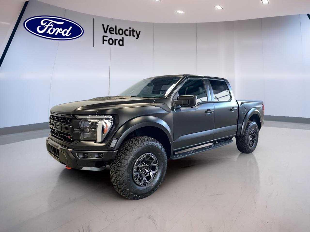 Experience unmatched power and capability with the 2025 Ford F-150 Raptor, now available at Velocity Ford in Moose Jaw. This used black Raptor is engineered for those who demand superior off-road performance and bold styling. Equipped with a 5.2L supercharged V8 engine and 4-wheel drive, it delivers exhilarating strength and control.

FEATURES OF THE F-150 Raptor  
»» 5.2L supercharged V8 engine for extreme power  
»» Electronic 10-speed automatic transmission for smooth shifts  
»» 4-wheel drive for confident all-terrain handling  
»» Distinctive black exterior for a commanding presence  

TRUCK FEATURES  
»» Exceptional towing capacity for heavy-duty tasks  
»» High ground clearance for off-road adventures  
»» Reinforced frame for rugged durability  
»» Large bed for versatile hauling needs  

ADVANCED SAFETY FEATURES  
»» Advanced traction control for enhanced stability  
»» Multiple airbags for comprehensive occupant protection  
»» Anti-lock braking system for safer stops  
»» Electronic stability control for confident driving  

PERFORMANCE AND EFFICIENCY  
»» 5.2L V8 delivers robust horsepower  
»» Supercharged engine for instant acceleration  
»» Electronic 10-speed automatic for optimized efficiency  
»» 4-wheel drive maximizes grip in all conditions  

COMFORT AND CONVENIENCE  
»» Spacious cabin for driver and passengers  
»» Dual-zone climate control for personalized comfort  
»» Power-adjustable drivers seat for easy customization  
»» Ample storage compartments throughout the interior  

TECHNOLOGY AND CONNECTIVITY  
»» Modern infotainment system with touchscreen display  
»» Bluetooth connectivity for hands-free communication  
»» Multiple USB ports for device charging  
»» Advanced sound system for immersive audio  

CARGO SPACE  
»» Generous truck bed for large loads  
»» Foldable rear seats for added storage  
»» Tie-down hooks to secure cargo  
»» Wide tailgate opening for easy access  

WHAT OTHER OWNERS LIKE  
»» Powerful supercharged V8 engine performance  
»» Confident off-road capabilities and high ground clearance  
»» Spacious and comfortable interior layout  
»» Advanced technology features for convenience and safety