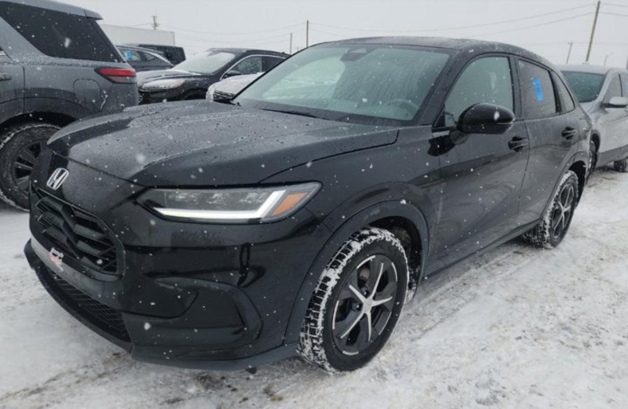 Come see this certified 2023 Honda HR-V Sport AWD | Sunroof | Heated Seats | Adaptive Cruise | Rear Cam | CarPlay | and More !. Its Automatic transmission and 2.0 L engine will keep you going. This Honda HR-V comes equipped with these options: Sunroof, Reverse Camera, Apple Car Play, Air Conditioning, Adaptive Cruise, Heated Seats, Tilt Steering Wheel, Steering Radio Controls, Power Windows, and Power Locks. See it for yourself at Mark Wilsons Better Used Cars, 5055 Whitelaw Road, Guelph, ON N1H 6J4.MASSIVE SELECTION: 500+ vehicles in ONE LOCATION, all Live Market Priced for the best value!STRAIGHTFORWARD & TRANSPARENT PRICING: Our Advertised Price INCLUDES:Safety Certification! (No separate certification fee upcharge).FREE Carfax History Report!NO upcharge for paying cash!CONFIDENCE & PEACE OF MIND: 30-Day/3,000 km Warranty INCLUDED! Plus a 5-Day Exchange Privilege!*EASY FINANCING: Better-than-bank rates, $0 Down, and 3 Months No Payments available OAC. BAD CREDIT APPROVED HERE!WE BUY CARS: Get Top Dollar for your trade, or sell us your vehicle for CASH even if you dont buy ours!www.shopwilsons.comAn Honest, Transparent Buying Experience. Trusted in business since 1961!(Cash Prices Exclude HST and Licensing Fees only.)