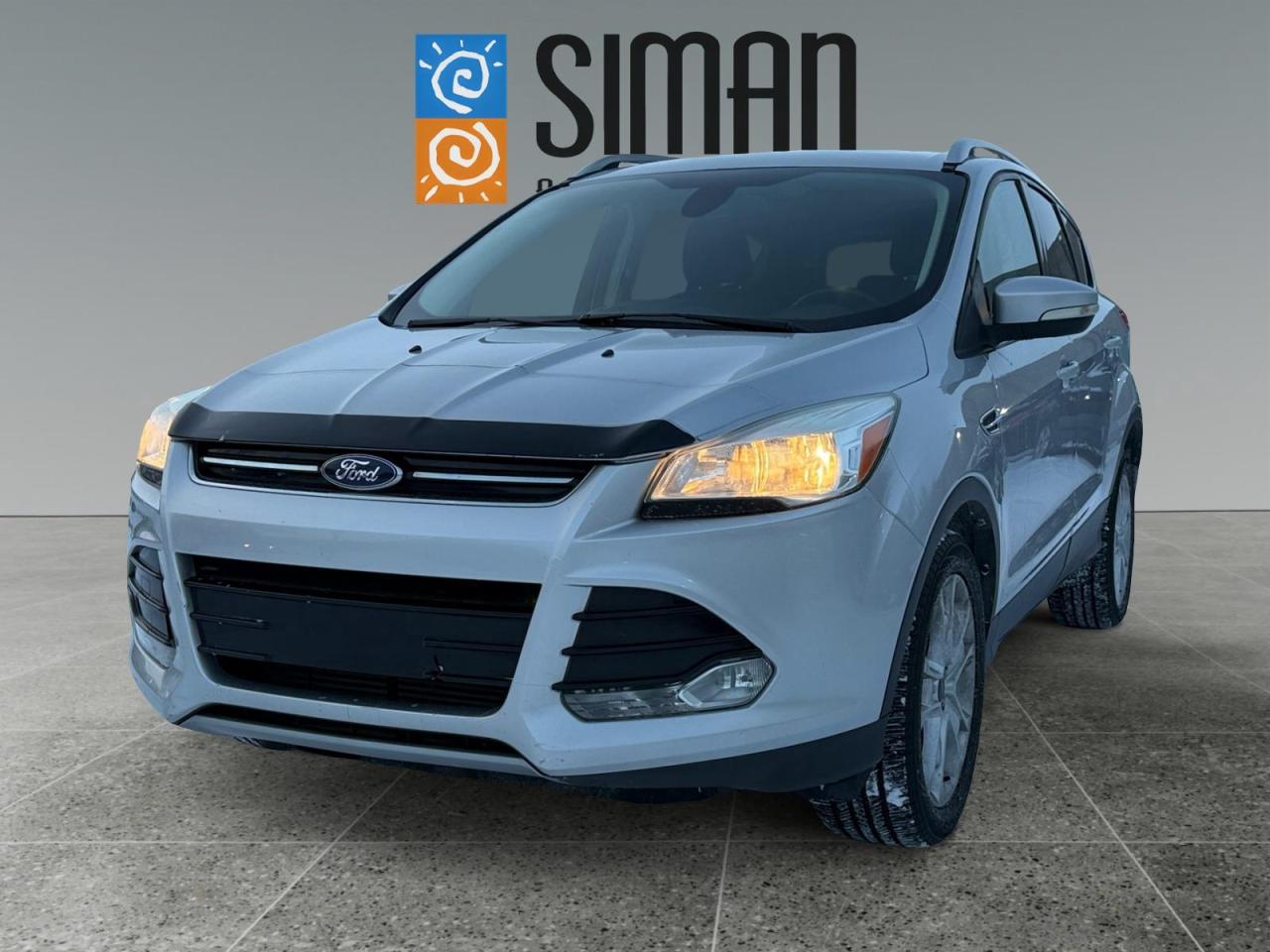 ## Adventure Ready: 2015 Ford Escape Titanium AWD

**Premium Comfort meets Saskatchewan Reliability.**

Are you looking for a versatile SUV that handles our winters with ease and keeps you pampered on every commute? This **2015 Ford Escape Titanium** is the perfect blend of high-end luxury and rugged capability.

### Why This Escape Stands Out:

* **Local & Trusted:** This is a proud **Saskatchewan vehicle** with a **Clean Carfax (Accident-Free)** history.
* **Meticulously Maintained:** Comes with **excellent service records**, so you can drive away with total peace of mind.
* **All-Season Capability:** Intelligent **All-Wheel Drive** paired with a factory **Trailer Tow Package** means youre ready for the lake or the snowstorm.

### Premium Features Youll Love:

* **Luxury Interior:** Sink into **Leather Heated Power Seats** and enjoy the view through the **Panoramic Sunroof**.
* **High-Tech Cabin:** Stay on track with **Navigation** and a **Back-up Camera**.
* **Ultimate Connectivity:** Bluetooth, SiriusXM Radio, and a CD player for the audiophiles.

---

### Why Choose Siman Auto Sales?

Weve been serving Saskatchewan for **over 27 years**. Our philosophy is simple: we are **large enough to make a difference and small enough to care.**

* **Easy Financing:** We work with **16 different banks and lenders** on-site to get you the best rate possible, regardless of your credit history.
* **Trades Welcome:** We want your current vehicle! Bring it in for a fair, transparent appraisal.
* **Protection for the Long Haul:** We offer a variety of **aftermarket warranties** designed to fit your specific driving needs and budget.
* **Proven Reputation:** Dont just take our word for it**check our reviews!** With over 70 vehicles in stock, we have the right fit for you.

---

**Ready to take it for a spin?**
Contact Us Today to Schedule a Test Drive