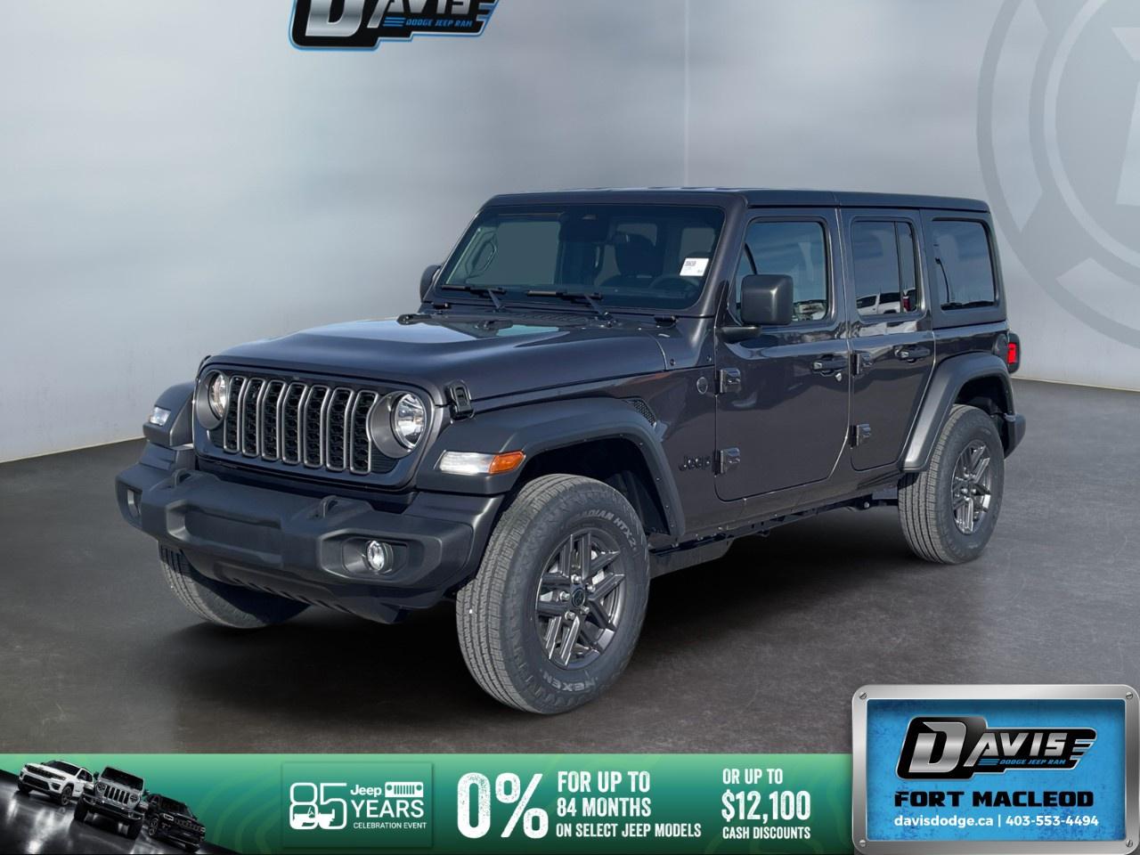 <p><strong>2026 Jeep Wrangler Sport S 4 Door 4x4 - Gray</strong></p> <p>Unleash your adventurous spirit with the new 2026 Jeep Wrangler Sport S in a striking gray exterior. Equipped with a reliable 4x4 drivetrain and enhanced handling capabilities, this SUV is ready for any terrain.</p> <p><strong>Interior Features:</strong></p> <ul><li>Stylish black cloth low-back bucket seats offer comfort and durability.</li><li>Convenience Group includes SOS Call & Roadside Assistance Call, and a 7" Colour In-Cluster Display.</li><li>Premium Wrapped Heated Steering Wheel for added driving comfort.</li><li>Sun Visors equipped with Illuminated Vanity Mirrors.</li><li>Comprehensive air conditioning with Automatic Temperature Control keeps you at the perfect climate.</li></ul> <p><strong>Exterior Features:</strong></p> <ul><li>Power Heated Exterior Mirrors to tackle those frosty Canadian mornings.</li><li>Black Freedom Top 3-Piece Hardtop with freedom panel storage bag.</li><li>Enhanced styling with a robust MOPAR Black Fuel-Filler Door.</li><li>17" x 7.5" alloy wheels that complement the Wrangler's bold stance.</li><li>Corning Gorilla Glass for reinforced safety and durability.</li></ul> <p><strong>Technology & Safety Features:</strong></p> <ul><li>Advanced Brake Assist & Full-Speed Forward Collision Warning Plus for added peace of mind.</li><li>Adaptive Cruise Control with Stop for smoother and effortless highway journeys.</li><li>Remote Start System for convenience in any weather.</li><li>Backup Camera, Bluetooth Connection, and Smart Device Integration for ultimate connectivity.</li><li>Wi-Fi Hotspot & Satellite Radio providing endless entertainment options.</li></ul> <p>This Jeep Wrangler Sport S is ideal for thrill-seekers and families alike, looking for a blend of rugged capability and modern technology. Contact Davis Dodge Fort Macleod today to schedule your test drive and open the doors to new adventures!</p>