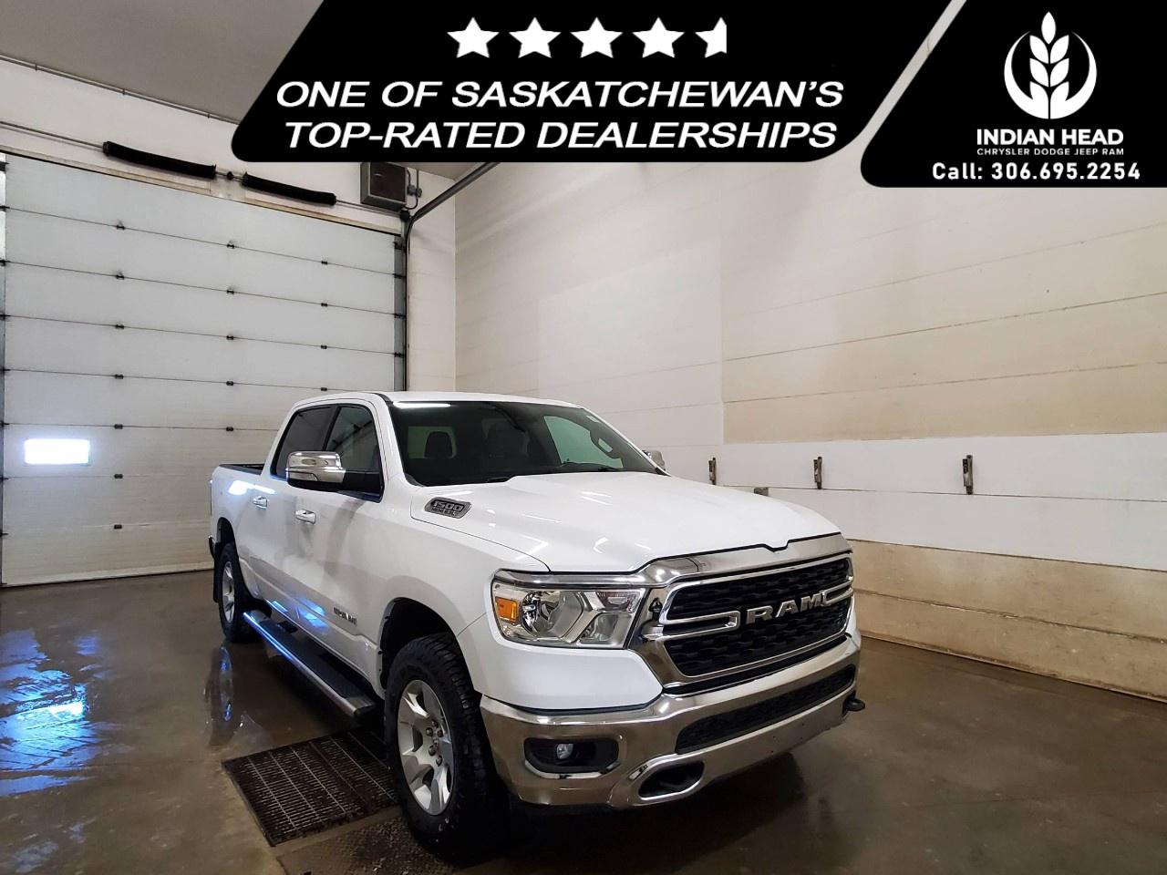 <p>The 2022 Ram 1500 Big Horn 4x4 Crew Cab 5'7" Box in a classic white finish offers a robust and reliable driving experience with its capable 4×4 drivetrain and smooth handling. Perfect for those seeking both style and utility, this truck exudes confidence on and off the road.</p> <p>Step inside to find a spacious interior adorned in elegant gray, where comfort meets practicality. The leather steering wheel and thoughtful styling elements elevate your driving experience. Whether you're heading out for a long journey or a quick drive around town, the interior is designed to keep you comfortable all the way.</p> <p>Equipped with modern technology, this Ram 1500 features a backup camera and Bluetooth connection for seamless connectivity and enhanced safety. Additional comforts like air conditioning and power windows ensure every drive is pleasurable. The truck also boasts brake assist and keyless entry, reinforcing its alignment with convenience and safety.</p> <p>This truck is an ideal choice for professionals and families alike who value power, practicality, and advanced technology in their vehicle. Contact our dealership today to learn more about how the 2022 Ram 1500 Big Horn can meet your driving needs.</p>