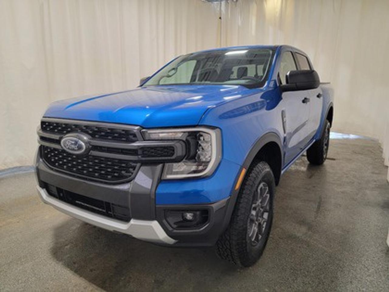 This all-new 2026 Ford Ranger XLT 301A looks absolutely stunning in Velocity Blue Metallic. This versatile compact pickup comes equipped with the 2.3L EcoBoost® engine, producing 270 horsepower and 310 lb-ft of torque. By leveraging EcoBoost® technology and a 10-speed automatic transmission, this truck is designed to achieve 11.2L/100 km (25 miles per gallon) combined highway/city fuel economy.

This vehicle comes with the All-Weather Packageready to take on any season!
Snow, rain, mud, or sunshinethis vehicle is built for it all! The All-Weather Package adds extra protection where it matters most, with premium mud flaps to shield your paint from road debris, all-weather floor mats to protect your interior from lifes messes, and Xpel paint protection to help guard against those infuriating rock chips. Drive with confidence, knowing your investment is protected from Regina's elements.

Key Features:
12 Centre Display
Dual Zone Temperature Control 
Rear Window W/Privacy Glass & Defrost
Ford Co-Pilot360
Rear View Camera
Lane Keeping System 
Rear Parking Sensors
Reverse Break Assist 
10-Way Power Drivers Seat 
Heated Front Seats 
17 Grey Painted Aluminum Wheels
Cruise Control
FordPass Connect
Selectable Drive Modes
8 Cluster Display
Advanced Towing Package

The 2026 Ranger XLT is built to handle Saskatchewans diverse driving conditions, offering both fuel efficiency and practical utility features like multiple Drive Modes: Normal, Eco, Sport, Tow/Haul, Slippery mode, Trailer Towing abilities, Auto highbeam headlamps and cruise control. 

Bennett Dunlop Ford, proudly serving Regina for over 40 years, is conveniently located at 770 Broad Street. With over 3,500 Google reviews, our reputation reflects our commitment to providing a fast, easy, and enjoyable vehicle-buying experience. We eliminate the hassle with no admin or documentation fees, transparent upfront pricing that lets you shop with total confidence. But were more than just a dealershipwere driven to make a difference by supporting local community initiatives and events that matter to you. Visit Bennett Dunlop Ford today and experience why were Reginas trusted choice for quality vehicles, exceptional service, and a genuine commitment to driving change in our community!
