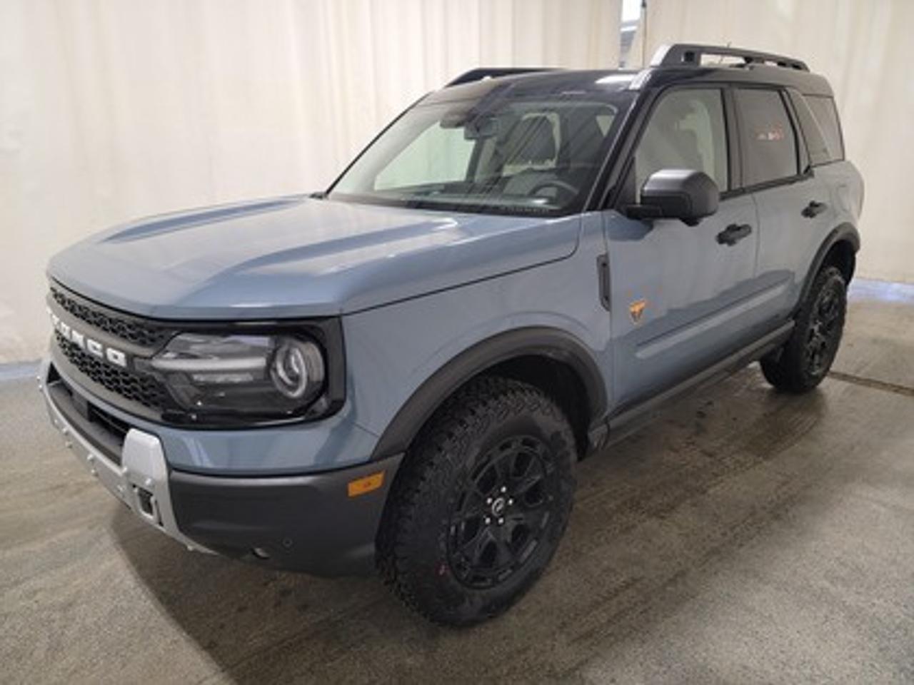 This all-new 2026 Ford Bronco Sport Badlands 400A stands out in Azure Grey Metallic Tri-Coat, showcasing a rugged yet refined look. This 5-passenger SUV is equipped with the 2.0L EcoBoost® engine, producing 250 horsepower and 277 lb-ft of torque. Paired with an 8-speed automatic transmission, this vehicle ensures seamless power delivery both on and off the road, it is engineered to conquer tough terrains with ease.

This vehicle comes with the All-Weather Packageready to take on any season!
Snow, rain, mud, or sunshinethis vehicle is built for it all! The All-Weather Package adds extra protection where it matters most, with premium mud flaps to shield your paint from road debris, all-weather floor mats to protect your interior from lifes messes, and Xpel paint protection to help guard against those infuriating rock chips. Drive with confidence, knowing your investment is protected from Regina's elements.

Key Features:
Advanced 4x4 with Terrain Management System and 7 G.O.A.T. Modes
Leather-Trimmed Sport Heated Front Seats
Heated Premium-Wrapped Steering Wheel
Rubberized Floor and Cargo Area for Easy Cleaning
HOSS 2.0 Off-Road Suspension
17 Matte Black-Painted Aluminum Wheels with All-Terrain Tires
Class II Trailer Tow Package with Trailer Sway Control
Ford Co-Pilot360 Assist 2.0, including:
360-Degree Camera with Trail View
Reverse Brake Assist
Front Parking Sensors
12.3 Digital Instrument Panel Cluster
SYNC® 4 with a 13.2 Center Display, featuring Wireless Apple CarPlay® and Android Auto
Trail Control with One-Pedal Driving
Power Moonroof
Sasquatch Badlands Package
Badlands Tech Package

Designed for adventure, the Badlands 400A delivers confidence in harsh weather and challenging landscapes. Features like D-ring recovery hooks, and a 110V/400W AC power outlet ensure you're equipped for any situation. Its tech-forward interior includes dual-zone automatic climate control and universal garage door opener, under seat storage compartment and even a bottle opener for ultimate convenience.

Bennett Dunlop Ford, proudly serving Regina for over 40 years, is conveniently located at 770 Broad Street. With over 3,500 Google reviews, our reputation reflects our commitment to providing a fast, easy, and enjoyable vehicle-buying experience. We eliminate the hassle with no admin or documentation fees, transparent upfront pricing that lets you shop with total confidence. But were more than just a dealershipwere driven to make a difference by supporting local community initiatives and events that matter to you. Visit Bennett Dunlop Ford today and experience why were Reginas trusted choice for quality vehicles, exceptional service, and a genuine commitment to driving change in our community!