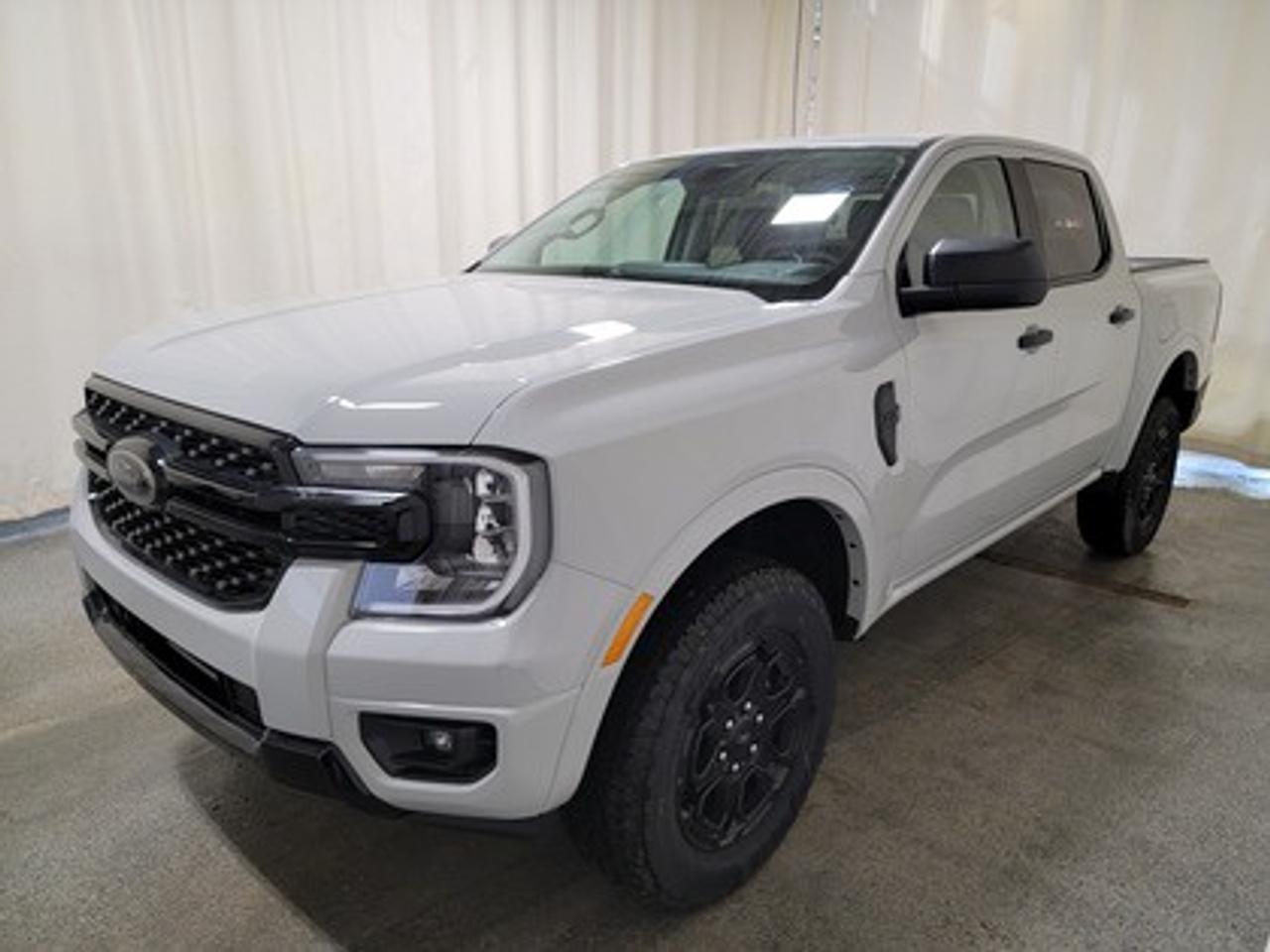 This all-new 2026 Ford Ranger XLT 301A looks absolutely stunning in Avalanche. This versatile compact pickup comes equipped with the 2.3L EcoBoost® engine, producing 270 horsepower and 310 lb-ft of torque. By leveraging EcoBoost® technology and a 10-speed automatic transmission, this truck is designed to achieve 11.2L/100 km (25 miles per gallon) combined highway/city fuel economy.

This vehicle comes with the All-Weather Packageready to take on any season!
Snow, rain, mud, or sunshinethis vehicle is built for it all! The All-Weather Package adds extra protection where it matters most, with premium mud flaps to shield your paint from road debris, all-weather floor mats to protect your interior from lifes messes, and Xpel paint protection to help guard against those infuriating rock chips. Drive with confidence, knowing your investment is protected from Regina's elements.

Key Features:
12 Centre Display
Dual Zone Temperature Control 
Rear Window W/Privacy Glass & Defrost
Ford Co-Pilot360
Rear View Camera
Lane Keeping System 
Rear Parking Sensors
Reverse Break Assist 
10-Way Power Drivers Seat 
Heated Front Seats 
17 Grey Painted Aluminum Wheels
Cruise Control
FordPass Connect
Selectable Drive Modes
8 Cluster Display
Black Appearance Package
Advanced Towing Package

The 2026 Ranger XLT is built to handle Saskatchewans diverse driving conditions, offering both fuel efficiency and practical utility features like multiple Drive Modes: Normal, Eco, Sport, Tow/Haul, Slippery mode, Trailer Towing abilities, Auto highbeam headlamps and cruise control. 

Bennett Dunlop Ford, proudly serving Regina for over 40 years, is conveniently located at 770 Broad Street. With over 3,500 Google reviews, our reputation reflects our commitment to providing a fast, easy, and enjoyable vehicle-buying experience. We eliminate the hassle with no admin or documentation fees, transparent upfront pricing that lets you shop with total confidence. But were more than just a dealershipwere driven to make a difference by supporting local community initiatives and events that matter to you. Visit Bennett Dunlop Ford today and experience why were Reginas trusted choice for quality vehicles, exceptional service, and a genuine commitment to driving change in our community!