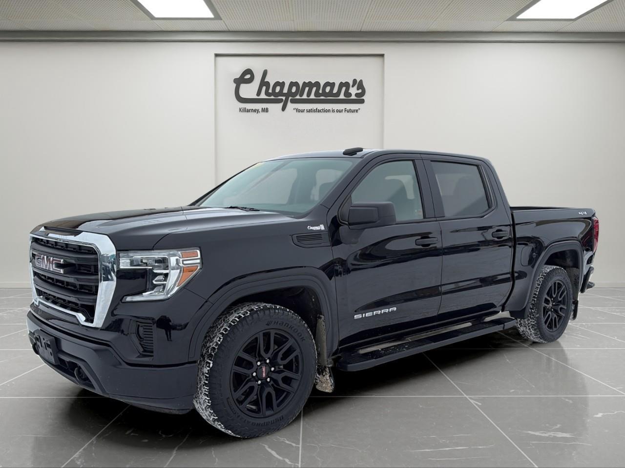 <p>The 2020 GMC Sierra 1500 Crew Cab Short Box delivers modern truck capability with everyday comfort and bold styling. Finished in <strong>Onyx Black</strong> with a <strong>Jet Black interior</strong>, this Sierra is equipped with the efficient <strong>2.7L Turbo engine</strong>, 4WD capability, and a strong mix of trailering features, technology, and practical design elements.</p><p><strong>Performance & Capability</strong></p><p>A balanced drivetrain designed for confident towing, hauling, and daily driving.</p><ul><li><p>2.7L Turbocharged 4-Cylinder Engine</p></li><li><p>8-Speed Automatic Transmission</p></li><li><p>4WD</p></li><li><p>Automatic Locking Rear Differential</p></li><li><p>Autotrac Single-Speed Transfer Case</p></li><li><p>Trailering Package</p></li><li><p>Hitch Guidance</p></li><li><p>Switch-Flexride Drive Mode System</p></li><li><p>Standard Suspension Package</p></li><li><p>Automatic Stop/Start</p></li><li><p>220-Amp Alternator</p></li><li><p>Engine Block Heater</p></li><li><p>Black Front Recovery Hooks</p></li></ul><p><strong>Interior Comfort & Convenience</strong></p><p>A functional cabin designed for durability and everyday usability.</p><ul><li><p>40/20/40 Front Split-Bench Seat</p></li><li><p>Driver 4-Way Manual Seat Adjuster</p></li><li><p>Passenger 4-Way Manual Seat Adjuster</p></li><li><p>Rear 60/40 Folding Bench Seat</p></li><li><p>Power Windows</p></li><li><p>Power Door Locks</p></li><li><p>Remote Keyless Entry</p></li><li><p>Tilt Steering Wheel</p></li><li><p>Cruise Control</p></li><li><p>Rear Window Defogger</p></li><li><p>Jet Black Interior</p></li></ul><p><strong>Technology & Connectivity</strong></p><p>Essential technology to keep you connected and informed on the road.</p><ul><li><p>GMC Infotainment System</p></li><li><p>7" Colour Touchscreen</p></li><li><p>USB Port</p></li><li><p>SiriusXM Radio</p></li><li><p>OnStar Services</p></li><li><p>4G LTE Wi-Fi Hotspot</p></li><li><p>6-Speaker Audio System</p></li><li><p>Teen Driver Technology</p></li><li><p>Rear Vision Camera</p></li><li><p>Tire Pressure Monitoring System</p></li></ul><p><strong>Safety & Driver Assistance</strong></p><p>Confidence-inspiring safety features designed for daily driving.</p><ul><li><p>4-Wheel Anti-Lock Braking System</p></li><li><p>Rear Vision Camera</p></li><li><p>Teen Driver System</p></li><li><p>Tire Pressure Monitoring System</p></li></ul><p><strong>Exterior Highlights</strong></p><p>Bold styling with functional truck-focused design elements.</p><ul><li><p>Onyx Black Exterior</p></li><li><p>20" Gloss Black Painted Aluminum Wheels</p></li><li><p>Tubular Assist Steps</p></li><li><p>Spray-On Bed Liner</p></li><li><p>LED Cargo Area Lighting</p></li><li><p>Rear Bumper CornerSteps</p></li><li><p>Power Heated Outside Mirrors</p></li><li><p>Deep Tint Rear Glass</p></li><li><p>Standard Tailgate</p></li><li><p>Spare Tire with Tire Carrier Lock</p></li><li><p>Single Outlet Exhaust</p></li><li><p>Canadian Base Equipment</p></li></ul><p>Price Includes Dealer Fee.</p><p>Price Excludes PST & GST.</p><p>Financing Options Available, Call For More Details.</p> <p><strong>*While every reasonable effort is made to ensure the accuracy of this information, we are not responsible for any error or omissions contained on these pages. Please verify any information in question with Chapman Motors Ltd.</strong></p>