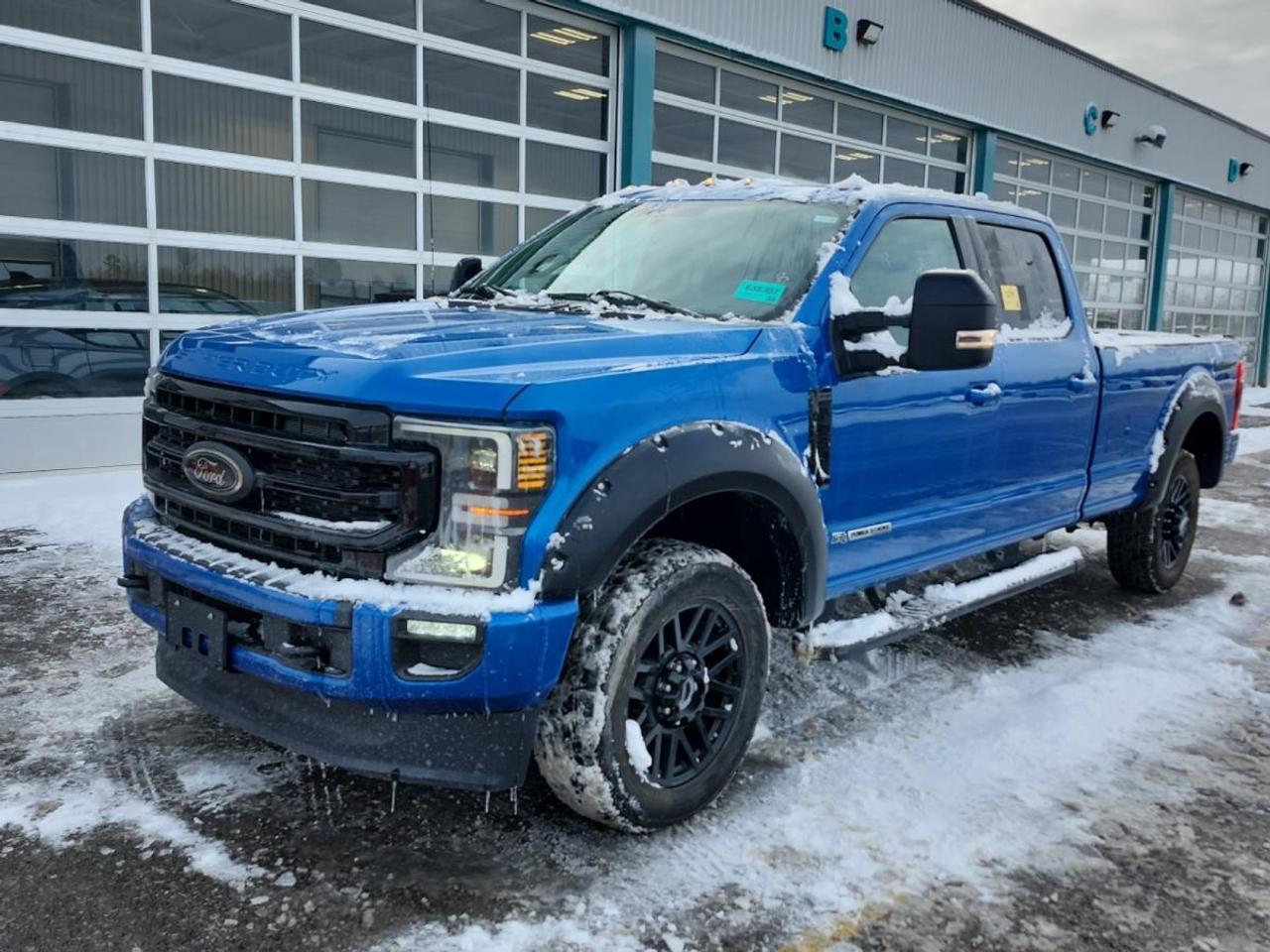 Built for serious work and refined for daily comfort, this used 2021 Ford Super Duty F-250 SRW LARIAT Crew Cab at Velocity Ford in Moose Jaw delivers the kind of confidence you want in a heavy-duty truck. Finished in blue with a black interior, it pairs a 6.7 L diesel engine with an automatic transmission for strong, steady power.

With 4 full doors and a spacious Crew Cab layout, this 2021 Ford Super Duty F-250 SRW LARIAT Crew Cab is ready for job sites, highway hauls, and family duty. It also brings a proven towing rating of 6,576 kg, giving you the muscle to move trailers, equipment, and weekend toys with ease.

TRUCK FEATURES  
»» 6,576 kg maximum towing capacity  
»» Four-wheel drive for tough conditions  
»» Limited slip differential for better traction  
»» Rear tow hook for recovery support  

ADVANCED SAFETY FEATURES  
»» Anti-lock braking system for controlled stops  
»» Stability control helps maintain vehicle balance  
»» Blind spot monitor for safer lane changes  
»» Backup camera for easier reversing  

PERFORMANCE AND EFFICIENCY  
»» 6.7 L diesel for strong torque  
»» Automatic transmission with dual shift mode  
»» Power steering for easier low-speed control  
»» Four-wheel drive for confident grip  

COMFORT AND CONVENIENCE  
»» Dual-zone automatic climate control comfort  
»» Heated front seats for cold mornings  
»» Power windows and automatic door locks  
»» Memory seats and adjustable pedals  

TECHNONOLGY AND CONNECTIVITY  
»» Bluetooth integration for hands-free calling  
»» Satellite radio and HD Radio  
»» WiFi hotspot for connected travel  
»» Steering wheel audio controls included  

CARGO SPACE  
»» Crew Cab offers flexible interior storage  
»» Rear trunk access for added utility  
»» Steps help with easier cabin entry  
»» Spare tire carried for roadside readiness  

WHAT OTHER OWNERS LIKE  
»» Strong diesel pulling power under load  
»» Confident towing and stable highway feel  
»» Comfortable cabin for long workdays  
»» Useful tech like camera, Bluetooth  

This 2021 Ford Super Duty F-250 SRW LARIAT Crew Cabs VIN is: 1FT7W2BT1MED34028.