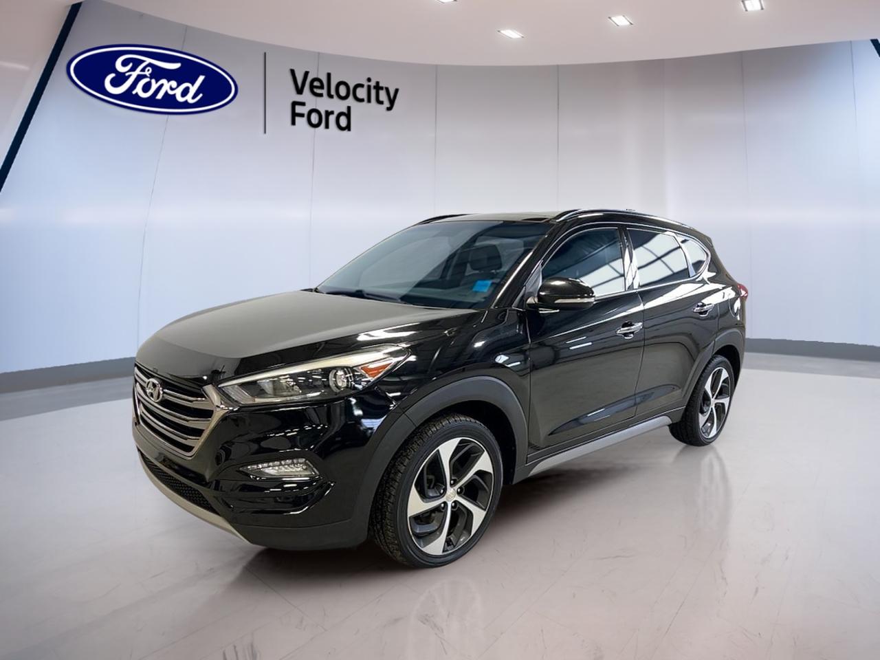 Meet the 2017 Hyundai Tucson SE AWD, now available used at Velocity Ford in Moose Jaw. Finished in black with a black interior, this compact SUV blends everyday comfort with confident all-wheel-drive traction. With a 1.6 L gas engine and a smooth 7-speed automatic transmission, its built for commutes, errands, and weekend plans.

This 2017 Hyundai Tucson SE AWD gives you the right mix of practical features and premium touches. Enjoy the open feel of a panoramic sunroof, the ease of a backup camera, and the reassurance of key safety tech. With 4 doors and smart storage, its ready for busy days and changing seasons in Saskatchewan.

FEATURES OF THE Tucson SE AWD
»» 1.6 L gas engine with AWD  
»» 7-speed automatic dual shift mode  
»» Panoramic sunroof for open-air feel  
»» Blind spot monitor for safer lane changes  

ADVANCED SAFETY FEATURES
»» Anti-lock braking system helps maintain control  
»» Stability control supports confident handling  
»» Side impact airbags for added protection  
»» Child safety locks for rear doors  

PERFORMANCE AND EFFICIENCY
»» 1.6 L gas engine for daily driving  
»» Automatic transmission for smooth shifting  
»» Dual shift mode for driver control  
»» Power steering for easy low-speed turns  

COMFORT AND CONVENIENCE
»» Dual-zone automatic climate control comfort  
»» Heated front seats for cold mornings  
»» Heated rear seats for passenger comfort  
»» Driver power seat with lumbar support  

TECHNONOLGY AND CONNECTIVITY
»» Bluetooth integration for hands-free calling  
»» Steering wheel audio controls included  
»» Satellite radio for more listening choice  
»» Backup camera for easier parking  

CARGO SPACE
»» Rear trunk access for quick loading  
»» Four-door layout aids daily usability  
»» Spare tire onboard for added readiness  
»» Rear spoiler adds a sporty finish  

AWARDS & RECOGNITIONS
»» Top Safety Pick, Insurance Institute for Highway Safety, 2017  

WHAT OTHER OWNERS LIKE
»» Confident all-wheel drive in bad weather  
»» Comfortable ride with useful seat heating  
»» Easy parking with backup camera view  
»» Handy tech like Bluetooth connectivity  

This SUV also includes tinted windows, fog lights, automatic headlights, heated mirrors, power windows, power steering, cruise control, and automatic door locks. Youll also appreciate turn signal mirrors, a rear window defroster, and a leather-wrapped steering wheel for a more refined feel.

This 2017 Hyundai Tucson SE AWDs VIN is: KM8J3CA20HU268317.
