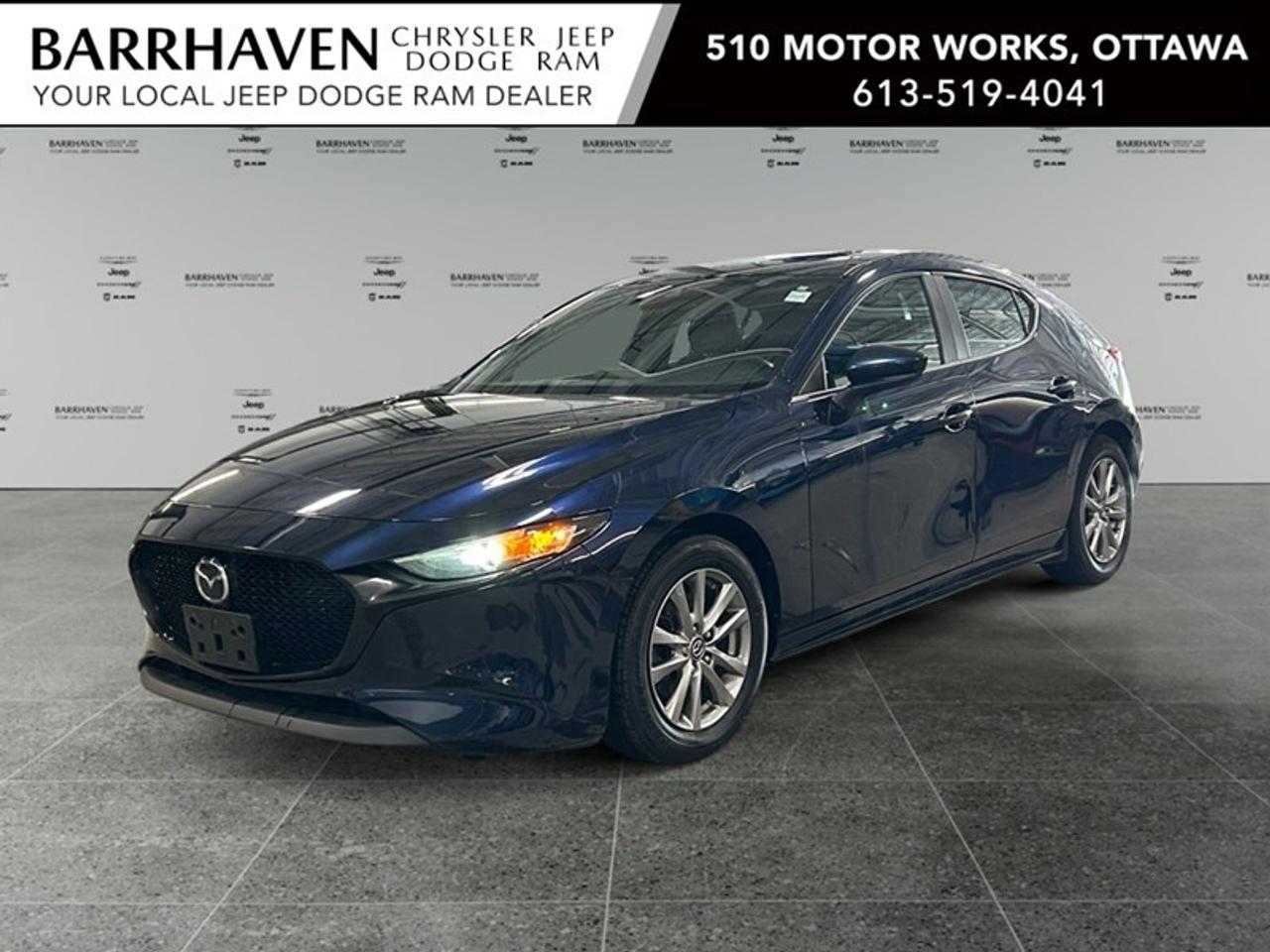 The 2020 Mazda3 Sport GS Auto i-ACTIV AWD in a striking blue color provides a confident and comfortable ride with its all-wheel drive. This hatchback model is perfect for those seeking a stylish yet functional vehicle. Step inside and experience the refined interior of the Mazda3 where luxury meets practicality with features like heated front seats, a leather steering wheel, and a user-friendly smart device integration. Enjoy every journey with the convenience of keyless entry, power windows, and adaptive cruise control ensuring a comfortable driving experience. Equipped with modern technology, it includes a backup camera for your safety and brake assist to enhance your driving confidence. Stay connected on the go with Bluetooth connectivity, and take advantage of lane assist for your peace of mind. Heated mirrors and a metal-look instrument panel trim add an extra layer of sophistication to your driving experience. This vehicle is an ideal choice for adventurers and families looking for an elegant and versatile car to match their lifestyle. Get in touch with us to learn more about the Mazda3 and schedule a test drive today. Dont miss the chance to own this remarkable hatchback, contact our dealership for more details.