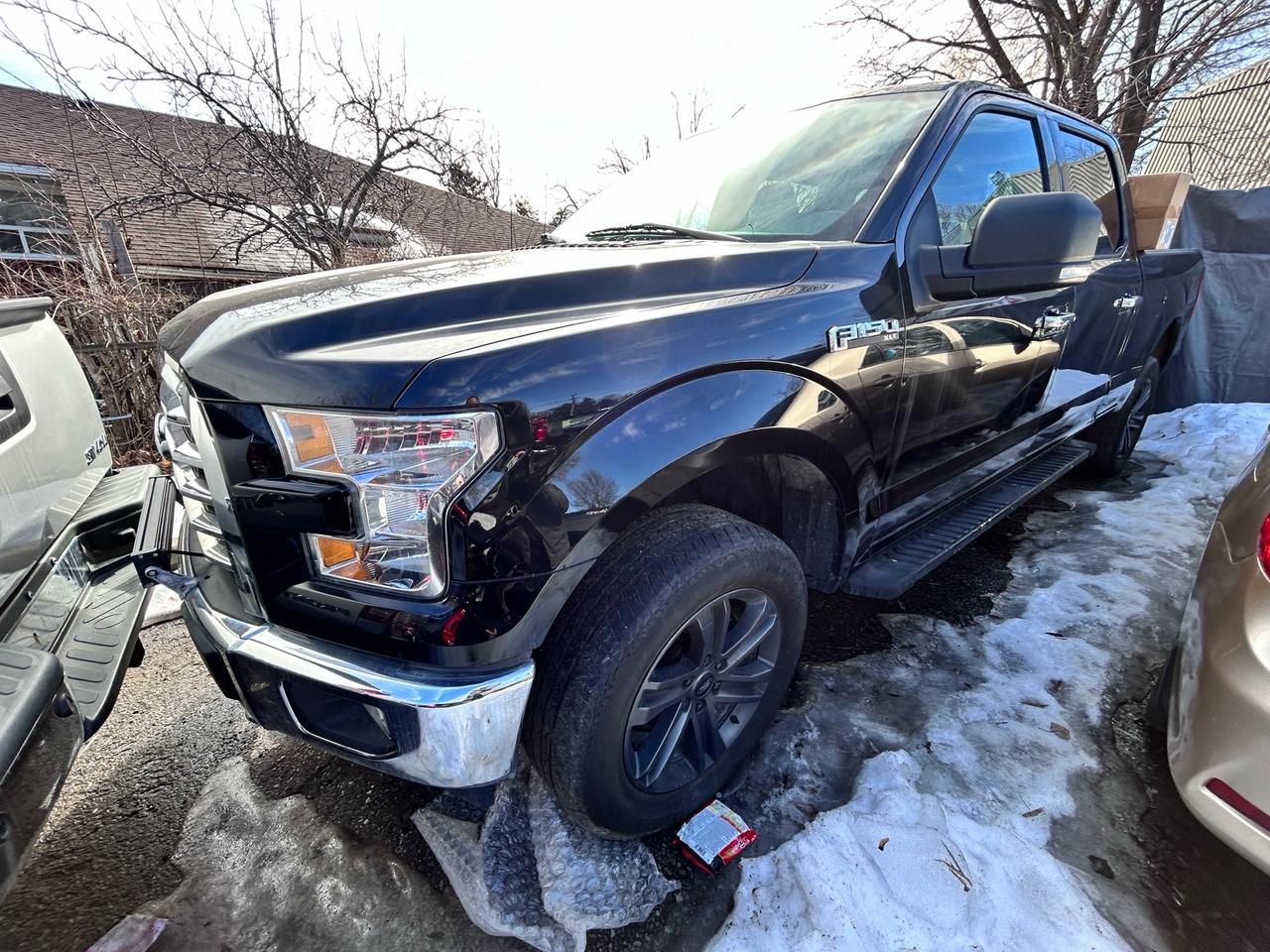 2015 RAM 1500 4WD Quad Cab 140.5 ST Photo