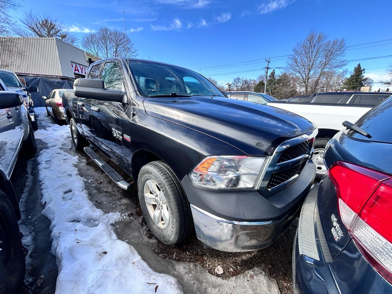 2015 RAM 1500 4WD Quad Cab 140.5 ST Photo