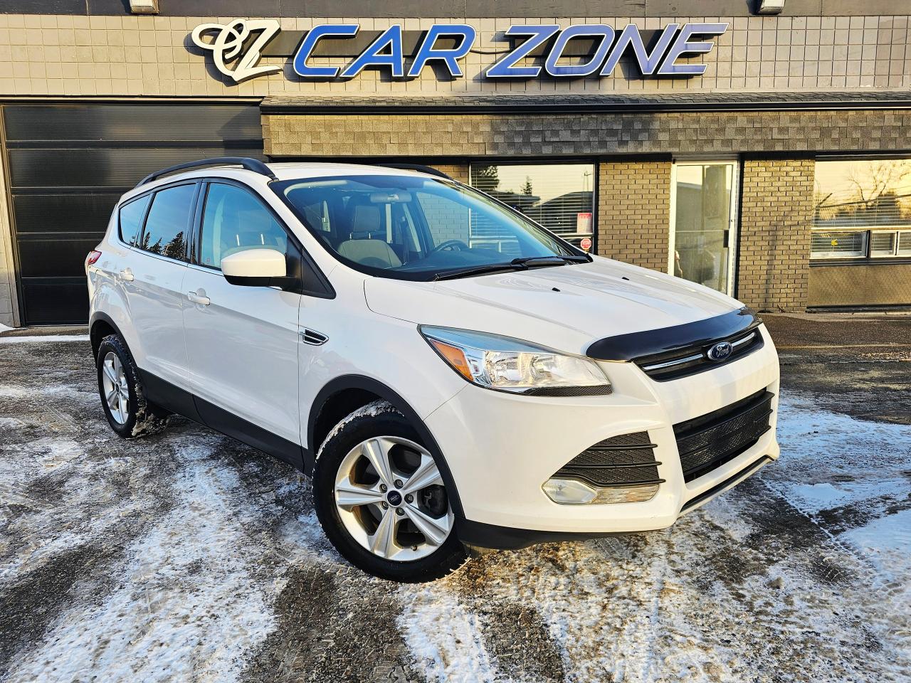 <p>Looking for a versatile and reliable SUV that can handle anything a Canadian winter throws your way? Then check out this sleek, white 2015 Ford Escape 4WD SE, now available at Car Zone! This Escape is ready to hit the road with its spacious interior, perfect for families or anyone who enjoys a bit of extra cargo room. With a fuel-efficient 2.0L I4 Turbo engine, youll get a great balance of power and economy, making those weekend getaways a breeze. This Escape has already proven its dependability.</p><p>Inside, youll find a comfortable gray interior thats both stylish and practical. The automatic transmission makes for a smooth and effortless driving experience, whether youre navigating city streets or cruising along the highway. And with its four-wheel drive capability, youll have the confidence to tackle any road conditions, from snowy commutes to off-the-beaten-path adventures. The Ford Escape is a popular choice for its reliability and practicality, so dont miss your chance to own this fantastic SUV!</p><p>Here are five features that make this 2015 Ford Escape a standout:</p><ul><li><strong>Turbocharged Engine:</strong> Experience the thrill of responsive power and performance!</li><li><strong>4-Wheel Drive:</strong> Conquer any terrain with confidence, perfect for those unpredictable Canadian winters.</li><li><strong>Spacious Interior:</strong> Plenty of room for passengers and cargo, making every journey comfortable.</li><li><strong>Automatic Transmission:</strong> Enjoy a smooth and effortless driving experience, ideal for daily commutes.</li><li><strong>Reliable Ford Build:</strong> Known for its dependability, you can count on this Escape for years to come.</li></ul><p>&nbsp;</p><p>Looking for Your Dream Car? Call Car Zone Today!</p><p>Thanks for viewing our Car Zone inventory. All of our vehicles come fully detailed with a Carfax and a mechanical fitness assessment. Drive this home today! Easy financing options. All credit welcome.&nbsp;<strong><a href=http://www.calgary.ca/finance>APPLY NOW</a>&nbsp;</strong>We even take trades. Same day approvals at&nbsp;<a href=http://www.carzonecalgary.ca/><strong>CARZONECALGARY</strong></a> or visit us in person at 2036 36 Street SE Calgary for a hassle free test drive. Let our friendly team of experts book an appointment with you and show you the Car Zone difference! AMVIC licensed dealer.&nbsp;</p>