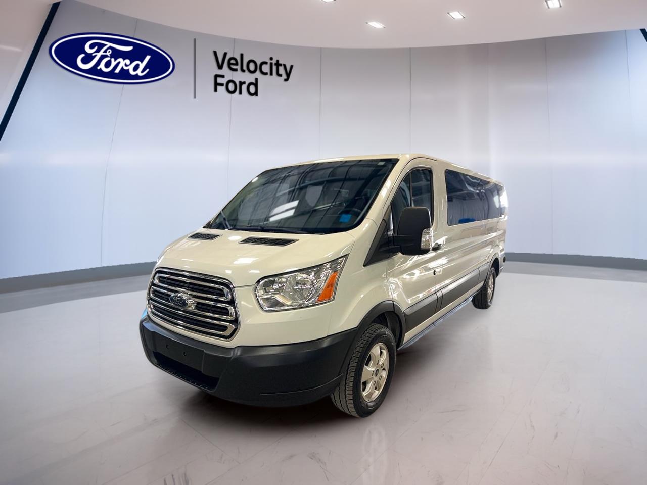 Built for busy days and big groups, this used 2019 Ford Transit Passenger Wagon XLT T-150 130 Low Roof is a smart choice for families, teams, and shuttle duty in Moose Jaw. Finished in white with a grey interior, it offers practical access through 3 doors, plus an automatic transmission and a proven 3.7 L gas engine. With 91,869 km, its ready to keep your plans moving with confidence. Available now at Velocity Ford, this Transit is set up for real-world comfort, safety, and easy driving in every season.

The 2019 Ford Transit Passenger Wagon XLT T-150 130 Low Roof is designed to make long days feel shorter. Power steering and a 6-speed automatic with dual shift mode help keep it smooth and predictable in traffic. Automatic headlights add convenience when light changes fast, while the backup camera makes tight parking spots easier to manage. Inside, front air conditioning and rear climate control help keep everyone comfortable, even when the cabin is full.

ADVANCED SAFETY FEATURES  
»» Anti-Lock Braking System for controlled stops  
»» Stability Control helps maintain confident handling  
»» Driver and passenger front airbags included  
»» Side impact airbags for added protection  

PERFORMANCE AND EFFICIENCY  
»» 3.7 L gas engine for reliability  
»» 6-speed automatic transmission for smooth shifts  
»» Dual shift mode for added control  
»» Power steering for easy low-speed manoeuvres  

COMFORT AND CONVENIENCE  
»» Front air conditioning for driver comfort  
»» Rear air conditioning for passenger comfort  
»» Rear climate control helps balance temperatures  
»» Adjustable steering wheel for better fit  

TECHNONOLGY AND CONNECTIVITY  
»» Backup camera aids parking and reversing  
»» Tire pressure monitoring helps track inflation  
»» Ambient lighting package adds cabin visibility  
»» Automatic headlights for hands-free illumination  

CARGO SPACE  
»» Passenger wagon layout supports group travel  
»» Spare tire included for added preparedness  
»» Rear tow hook for practical utility  
»» Automatic door locks add everyday security  

WHAT OTHER OWNERS LIKE  
»» Easy driving position and clear visibility  
»» Confident handling with stability control  
»» Helpful backup camera for city parking  
»» Rear air conditioning for passenger comfort  

This 2019 Ford Transit Passenger Wagon XLT T-150 130 Low Roofs VIN is: 1FBZX2YM4KKA44245.