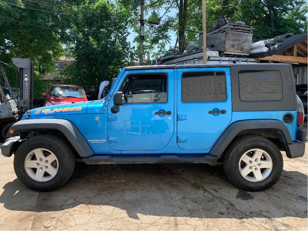 2010 Jeep WRANGLER UNLIMITED 4WD 4dr Islander 6 SPEED TRANS Photo