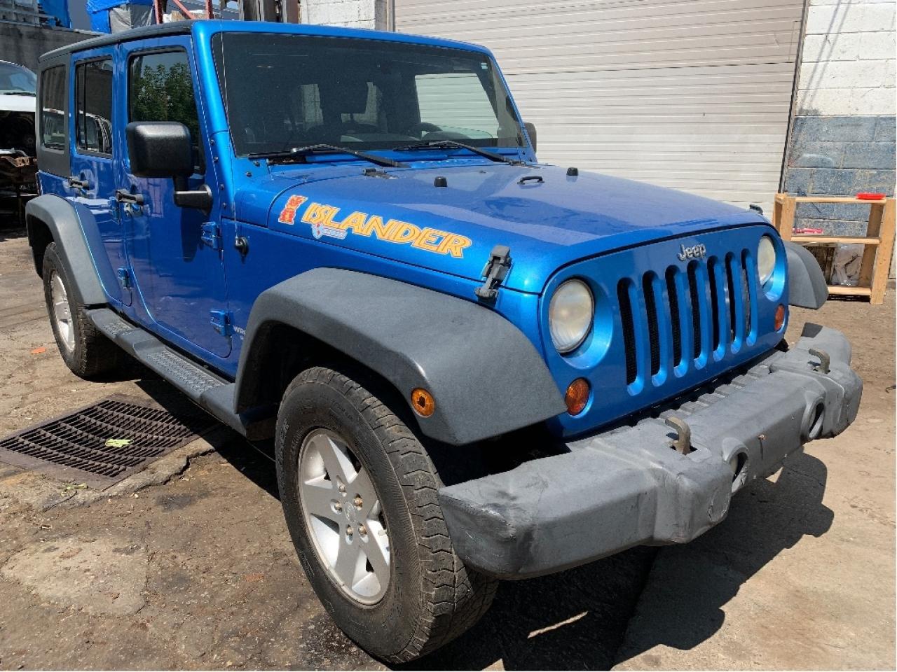 2010 Jeep WRANGLER UNLIMITED 4WD 4dr Islander 6 SPEED TRANS Photo