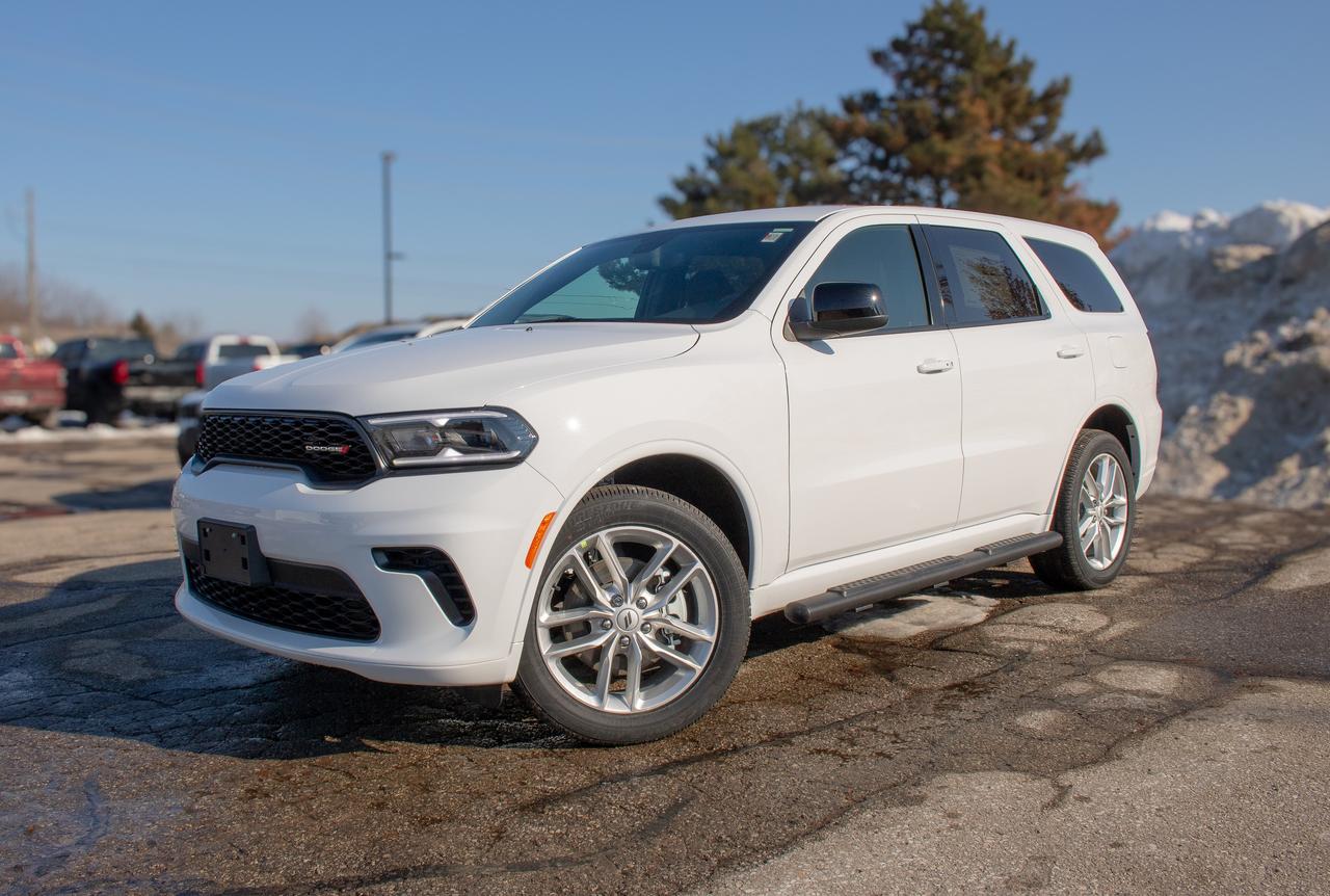 Built for action, the 2026 Dodge Durango GT AWD in White Knuckle delivers sporty strength and confidence for spirited adventures. Powered by a 5.7 Litre HEMI V8 serving up 360hp to a paddle-shifted 8 Speed Automatic transmission for moving with muscular confidence. This All Wheel Drive SUV also had a rear load-leveling suspension for enhanced capability, and it sees approximately 10.7L/100km on the highway. Looking bold and assertive, our Durango shows off LED lighting, dual exhaust outlets, 20-inch alloy wheels, a power liftgate, and gloss-black heated power mirrors.  The Durango GT cabin supports up to seven occupants with standard three-row seating and features a 10.1-inch touchscreen powered by Uconnect&reg; 5. Wireless Apple CarPlay&reg; and Android Auto&reg;, Bluetooth&reg;, WiFi compatibility, and a 6-speaker Alpine audio system help keep everyone connected and entertained.  Dodge has your back with high-tech safety, protecting you and your crew with blind-spot monitoring, a rearview camera, rear cross-path detection, rear parking sensors, hill start assist, trailer sway damping, tire pressure monitoring, stability/traction control, and more. Families love the fierce nature of our fantastic Durango GT! Save this Page and Call for Availability. We Know You Will Enjoy Your Test Drive Towards Ownership!