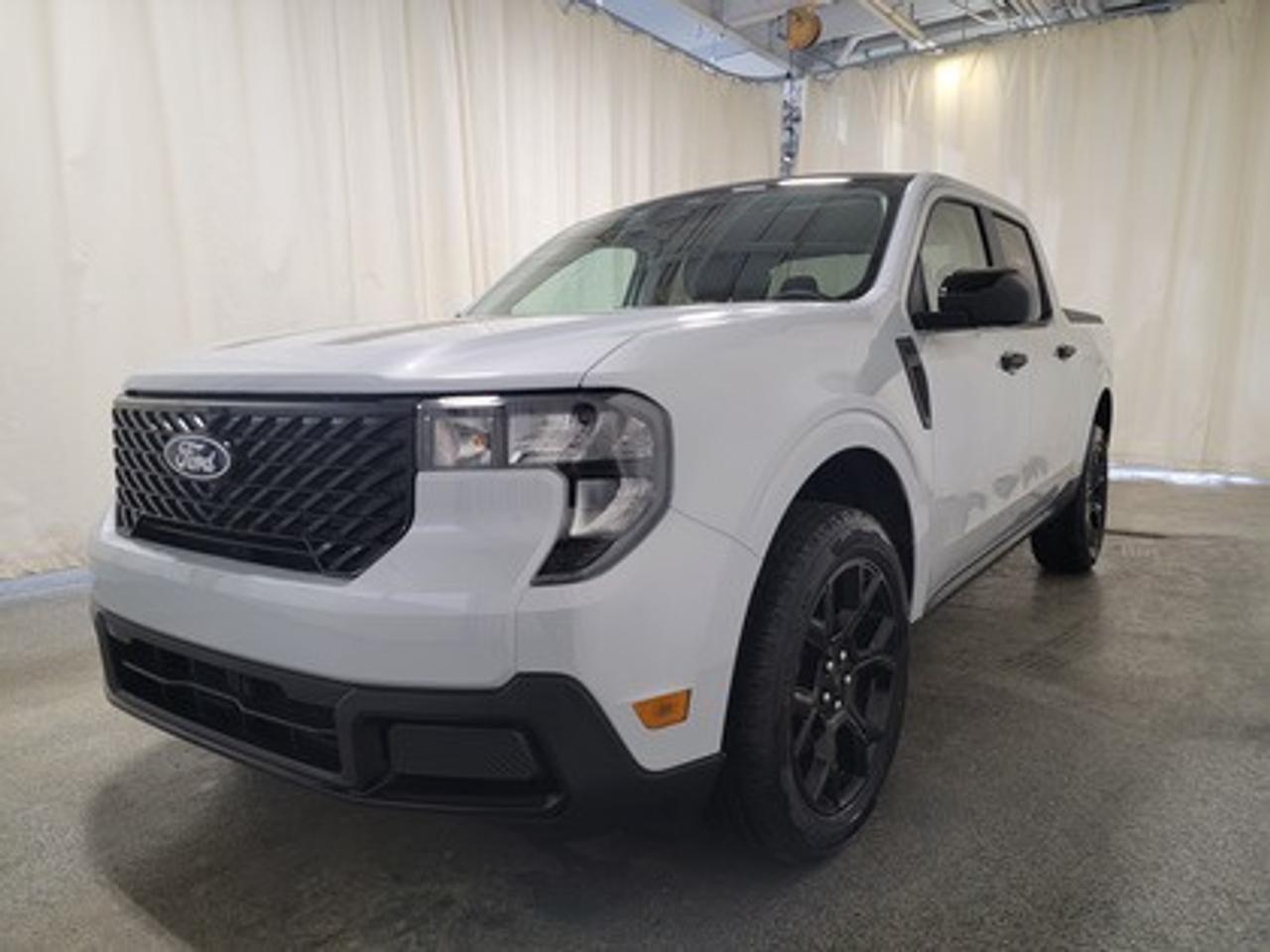 This 2026 Ford Maverick XLT 301A stands out in Space White Metallic, combining the versatility of a pickup with the efficiency and convenience of a compact truck. Equipped with the 2.5L Hybrid engine this truck delivers 191 horsepower and 155 lb-ft of torque, with a 94-kW electric motor paired with a CVT transmission for smooth performance and an estimated 6.4L/100 km (44 miles per gallon) combined fuel economy.

This vehicle comes with the All-Weather Packageready to take on any season! 

Snow, rain, mud, or sunshinethis vehicle is built for it all! The All-Weather Package adds extra protection where it matters most, with premium mud flaps to shield your paint from road debris, all-weather floor mats to protect your interior from lifes messes, and Xpel paint protection to help guard against those infuriating rock chips. Drive with confidence, knowing your investment is protected from Regina's elements. 

Key Features:
Tire Inflator and Sealant Kit
FordPass Connectivity for remote vehicle control
Ford Co-Pilot360
Trailer Sway Control
Remote Keyless Entry
17 Carbonized Grey-Painted Aluminum Wheels
P225/65R17 A/S BSW Wheels
Lane Keeping Aid
Rear View Camera
Automatic LED High Beams
LED Headlamps
Manual Tailgate Lock
8 Center Stack Screen
Electronic Stability Control
Cruise Control
Conventional Spare Tire
XLT Luxury Package
Black Appearance Package

The 2026 Maverick XLT 301A is engineered for Saskatchewans extreme weather and diverse driving conditions, offering a comfortable, tech-savvy, and fuel-efficient experience. With heated front seats, rear under-seat storage bins, and advanced driver-assist technologies, this truck delivers both practicality and peace of mind for everyday driving.

Bennett Dunlop Ford, proudly serving Regina for over 40 years, is conveniently located at 770 Broad Street. With over 3,500 Google reviews, our reputation reflects our commitment to providing a fast, easy, and enjoyable vehicle-buying experience. We eliminate the hassle with no admin or documentation fees, transparent upfront pricing lets you shop with total confidence. But were more than just a dealershipwere driven to make a difference by supporting local community initiatives and events that matter to you. Visit Bennett Dunlop Ford today and experience why were Reginas trusted choice for quality vehicles, exceptional service, and a genuine commitment to driving change in our community!