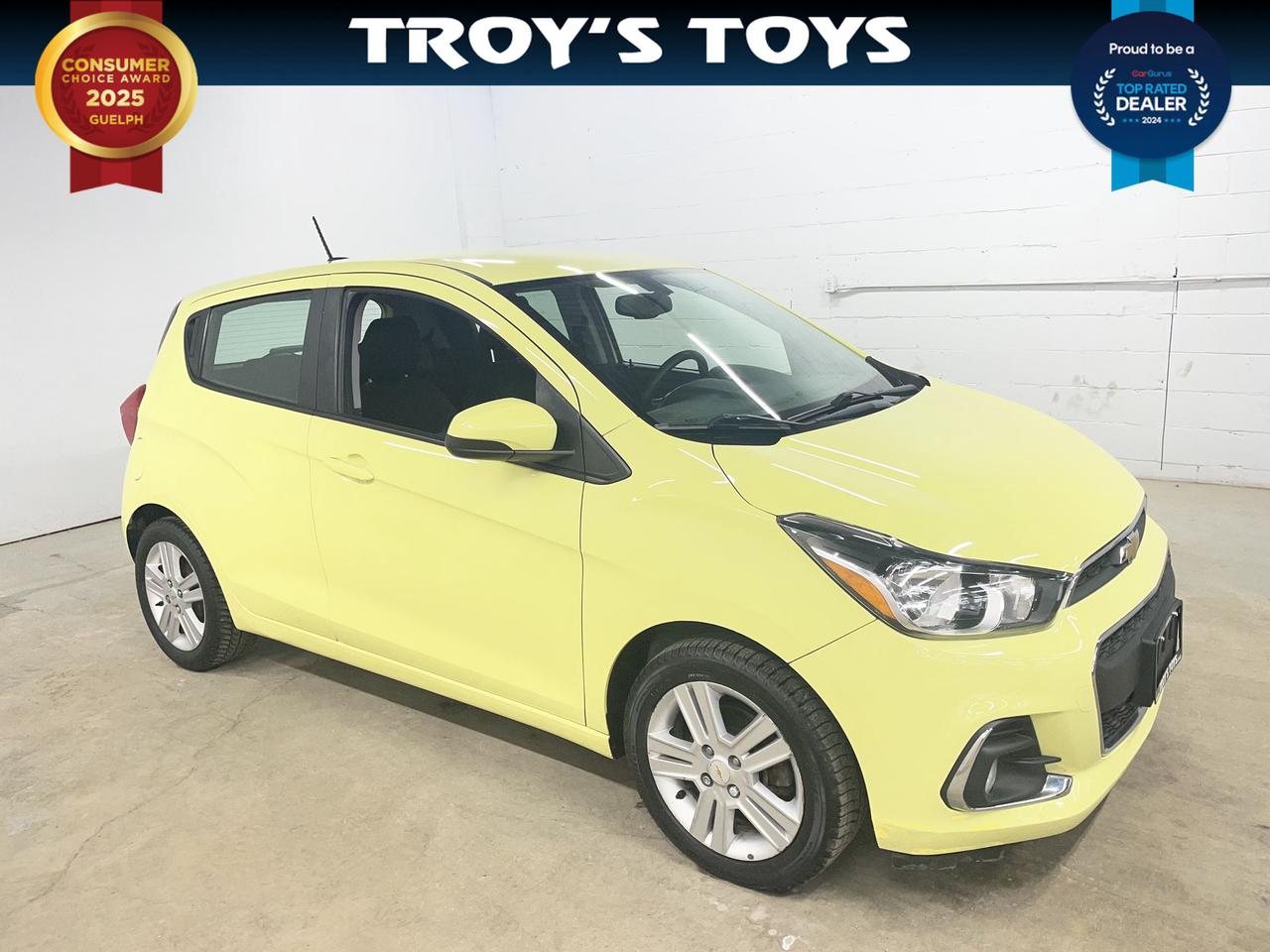 <p>Looking for a fun and economical ride? Check out this vibrant 2018 Chevrolet Spark LT, available now at Troys Toys! This zippy little hatchback is perfect for navigating city streets and offers impressive fuel efficiency, making it a smart choice for both your wallet and the environment. With its cheerful yellow exterior and sleek black interior, this Spark is sure to turn heads wherever you go. This particular Spark has 112,038 km on the odometer.</p><p>This 2018 Spark LT is equipped with a smooth and efficient CVT transmission, offering a comfortable and responsive driving experience. The four-door design provides easy access for passengers and cargo alike, while the front-wheel-drive system ensures confident handling in various driving conditions. Dont miss the chance to own a practical and stylish vehicle thats perfect for everyday adventures!</p><p>Here are some of the standout features that make this Spark a winner:</p><ul><li><strong>Fuel Sipping Efficiency:</strong> Save big at the pumps with this Sparks impressive fuel economy!</li><li><strong>City-Friendly Size:</strong> Effortlessly navigate tight parking spots and bustling city streets.</li><li><strong>Modern Infotainment:</strong> Stay connected and entertained with its user-friendly infotainment system.</li><li><strong>Eye-Catching Style:</strong> Make a statement with the vibrant yellow exterior &ndash; a guaranteed head-turner.</li><li><strong>Surprisingly Spacious Interior:</strong> Despite its compact size, the Spark offers a surprisingly roomy interior for both passengers and cargo.</li></ul><p><strong><em>Powered by AutoIntelligence&trade;</em></strong> Vehicle information has been generated using artificial intelligence and is provided for informational purposes only. While efforts are made to ensure accuracy, please confirm all details directly with the dealer.</p>