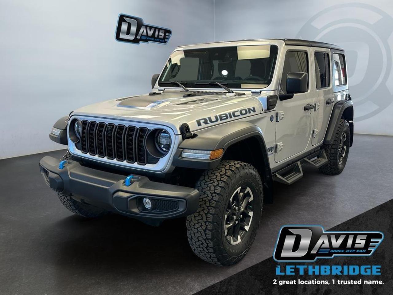 <b>Low Mileage, Heavy Duty Suspension, Hybrid, Fast Charging, Adaptive Cruise Control, Climate Control!</b><br /> <br /> This Jeep Wrangler 4xe is the culmination of tireless innovation and extensive testing to built the ultimate off-road SUV. This 2024 Jeep Wrangler 4xe is fresh on our lot in Lethbridge. <br /> <br />No matter where your next adventure takes you, this Jeep Wrangler 4xe is ready for the challenge. With advanced traction and plug-in hybrid technology, sophisticated safety features and ample ground clearance, the Wrangler 4xe is designed to climb up and crawl over the toughest terrain. Inside the cabin of this advanced Wrangler 4xe offers supportive seats and comes loaded with the technology you expect while staying loyal to the style and design you've come to know and love. This low mileage SUV has just 15,268 km. Stock number 41112 is Silver in colour. It has an Automatic transmission and is powered by a 375HP 2.0L 4 Cylinder Engine. <br /> <br /> Our Wrangler 4xe's trim level is Rubicon. Stepping up to this Wrangler Rubicon rewards you with incredible off-roading capability, thanks to heavy duty suspension, front active and rear anti-roll bars, upfitter switches, locking front and rear differentials, and skid plates for undercarriage protection. Interior features include an 8-speaker Alpine audio system, voice-activated dual zone climate control, front and rear cupholders, and a 12.3-inch infotainment system with smartphone integration and mobile internet hotspot access. Additional features include cruise control, a leatherette-wrapped steering wheel, proximity keyless entry, and even more. This vehicle has been upgraded with the following features: Heavy Duty Suspension, Hybrid, Fast Charging, Adaptive Cruise Control, Climate Control, Wi-Fi Hotspot, Fog Lamps.<br /> <br />To apply right now for financing use this link: <a href=https://lethbridge.davisdodge.ca/free-credit-check/ target=_blank rel=nofollow noopener noreferrer>https://lethbridge.davisdodge.ca/free-credit-check/</a><br /><br /> <br /><br />Locally Owned & Trusted for Over 35 Years  Davis Dodge in Lethbridge, AB <br /><br /> At Davis Dodge, weve proudly served the Lethbridge community for more than 35 years, offering an unparalleled car buying experience. Dont just take our word for itour Google reviews speak volumes about our commitment to exceptional service. <br /><br /> Delivery & At-Home Test Drives: Convenient options to suit your lifestyle. <br /><br /> Flexible Financing for Everyone: Get the vehicle you need with financing solutions tailored to your situation. <br /><br /> Full Mechanical Inspections & Professional Cleaning: Every vehicle is thoroughly inspected and cleaned before it hits our lot.<br /><br /> We take all makes and models on trade and offer competitive pricing with inventory that changes daily. Whether you're shopping for a Chrysler, Dodge, Jeep, RAM, or FIAT, our AMVIC Licensed dealership makes it easy to browse, buy, and drive away.<br /><br /> Located in Lethbridge, AB, we proudly serve customers in Fort Macleod, Taber, Claresholm, and Coaldale. Shop online or visit us today to experience the best in sales, service, and selection. Standard bank rates apply; taxes are additional.<br /><br /> Vehicle pricing offer shown expires 2026-02-28. <br /> Come by and check out our fleet of 60+ used cars and trucks and 130+ new cars and trucks for sale in Lethbridge. o~o