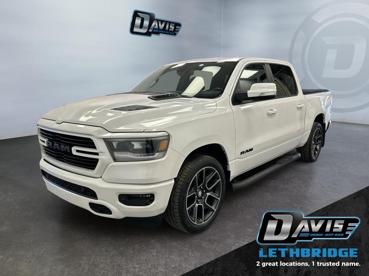 <b>Heated Seats, Remote Start, Heated Steering Wheel, Aluminum Wheels, Proximity Key!</b><br /> <br /> Fully redesigned for 2019, this Ram 1500 has reduced weight and increased payload and towing capacity over the previous generations. This 2019 Ram 1500 is fresh on our lot in Lethbridge. <br /> <br />The Ram 1500 delivers power and performance everywhere you need it, with a tech-forward cabin that is all about comfort and convenience. Loaded with best-in-class features, it's easy to see why the Ram 1500 is so popular. With the most towing and hauling capability in a Ram 1500, as well as improved efficiency and exceptional capability, this truck has the grit to take on any task. This Crew Cab 4X4 pickup has 93,996 km. Stock number 41077 is White in colour. It has an Automatic transmission and is powered by a 395HP 5.7L 8 Cylinder Engine. It may have some remaining factory warranty, please check with dealer for details. <br /> <br /> Our 1500's trim level is Sport. This Ram 1500 Sport comes very well equipped with performance styling, unique aluminum wheels, a heated leather steering wheel, heated front seats, Uconnect with a larger touchscreen, wireless streaming audio, USB input jacks, and a useful rear view camera. This sleek pickup truck also comes with body-colored bumpers with rear step, a power rear window and power heated side mirrors, proximity keyless entry, cruise control, LED Lights, an HD suspension, towing equipment, a Parkview rear camera, front fog lights and so much more. This vehicle has been upgraded with the following features: Heated Seats, Remote Start, Heated Steering Wheel, Aluminum Wheels, Proximity Key, LED Lights, Touchscreen.<br /> <br />To apply right now for financing use this link: <a href=https://lethbridge.davisdodge.ca/free-credit-check/ target=_blank rel=nofollow noopener noreferrer>https://lethbridge.davisdodge.ca/free-credit-check/</a><br /><br /> <br /><br />Locally Owned & Trusted for Over 35 Years  Davis Dodge in Lethbridge, AB <br /><br /> At Davis Dodge, weve proudly served the Lethbridge community for more than 35 years, offering an unparalleled car buying experience. Dont just take our word for itour Google reviews speak volumes about our commitment to exceptional service. <br /><br /> Delivery & At-Home Test Drives: Convenient options to suit your lifestyle. <br /><br /> Flexible Financing for Everyone: Get the vehicle you need with financing solutions tailored to your situation. <br /><br /> Full Mechanical Inspections & Professional Cleaning: Every vehicle is thoroughly inspected and cleaned before it hits our lot.<br /><br /> We take all makes and models on trade and offer competitive pricing with inventory that changes daily. Whether you're shopping for a Chrysler, Dodge, Jeep, RAM, or FIAT, our AMVIC Licensed dealership makes it easy to browse, buy, and drive away.<br /><br /> Located in Lethbridge, AB, we proudly serve customers in Fort Macleod, Taber, Claresholm, and Coaldale. Shop online or visit us today to experience the best in sales, service, and selection. Standard bank rates apply; taxes are additional.<br /><br /> Vehicle pricing offer shown expires 2026-02-28. <br /> Come by and check out our fleet of 60+ used cars and trucks and 130+ new cars and trucks for sale in Lethbridge. o~o