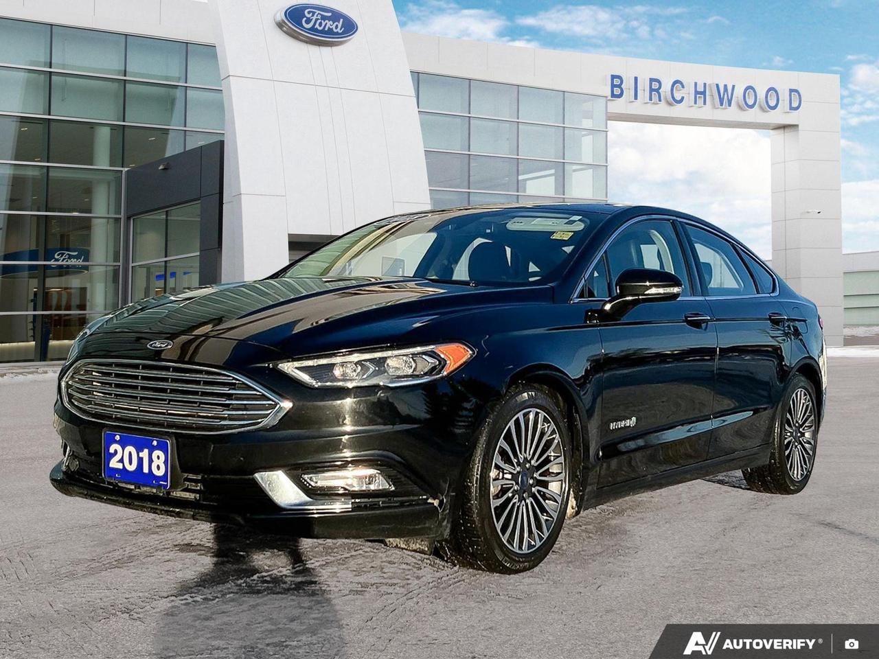 Local Vehicle!
Good Condition!
Experience the future of driving with this 2018 Ford Fusion Hybrid Titanium! This sleek sedan combines eco-friendly performance with luxurious comfort, making it the perfect choice for the environmentally conscious driver who doesnt want to compromise on style or features.

- Efficient 2.0L 4-cylinder hybrid engine for impressive fuel economy
- Luxurious black leather interior for a premium driving experience
- Advanced safety features including back-up camera and airbag occupancy sensor
- Bluetooth wireless connectivity for seamless smartphone integration
- Dual-zone automatic climate control for personalized comfort
- 18 machine-faced aluminum wheels with magnetic painted pockets
- Convenient remote releases for cargo access and fuel door

Dont miss this opportunity to own a sophisticated hybrid sedan that delivers both performance and efficiency. Visit Birchwood Ford today to take this Ford Fusion Hybrid for a test drive. Our knowledgeable staff is ready to answer any questions and help you explore financing options. Experience the perfect blend of eco-friendly technology and luxury  schedule your appointment now!
Dealer permit #4454