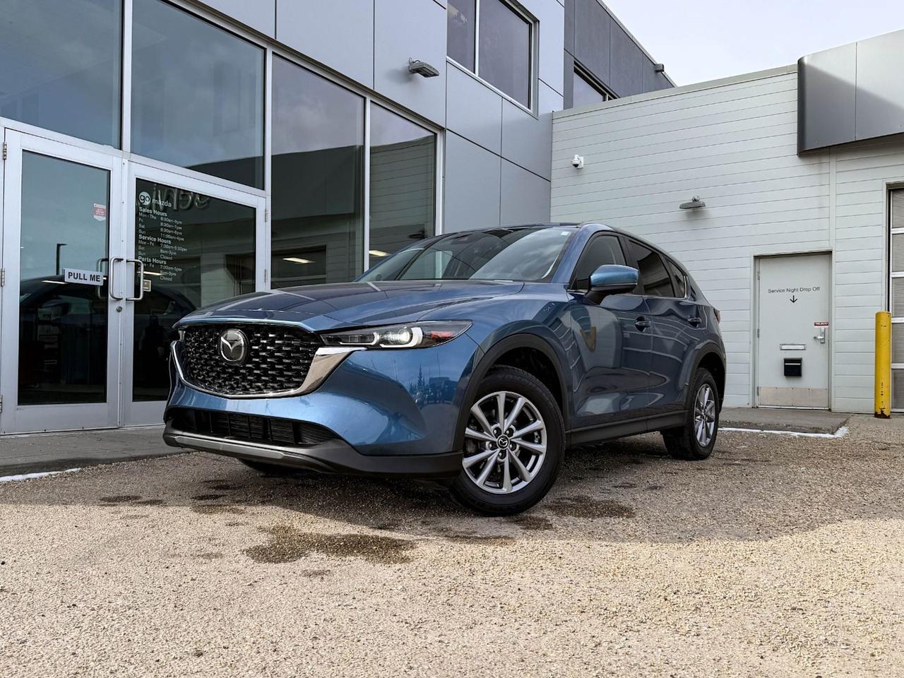 Discover the perfect blend of style, performance, and comfort with this pre-owned 2022 Mazda CX-5 GS AWD in stunning Blue with a sleek Black leather interior. Powered by a responsive 2.5L SKYACTIV-G engine paired with a smooth 6-speed automatic transmission and full-time all-wheel drive, its engineered for confident handling in any condition.Step inside to heated leather seats, a spacious cabin loaded with advanced tech like a 10.2-inch display, wireless audio streaming, and smart device mirroring. Safety is top-notch with blind spot warning, lane departure prevention, forward collision mitigation, and more.With 19-inch Black Metallic alloy wheels and LED headlights, this CX-5 commands attention on the road. Experience luxury, safety, and Mazdas signature driving dynamics all in one versatile SUV. Schedule your test drive today!Go Mazda is an AMVIC licensed businessThis vehicle has been registered in the province ofQuébec and is showing a CarFax incident in the amount of $11,630.77