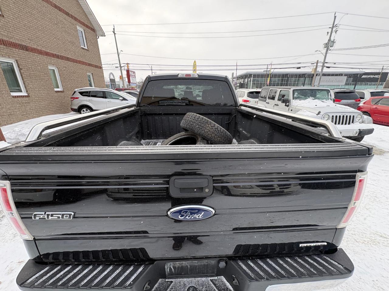 2014 Ford F-150 4WD SuperCab 163" XLT, Low KM, with Safety and 1 year $5000 per claim Warranty Photo