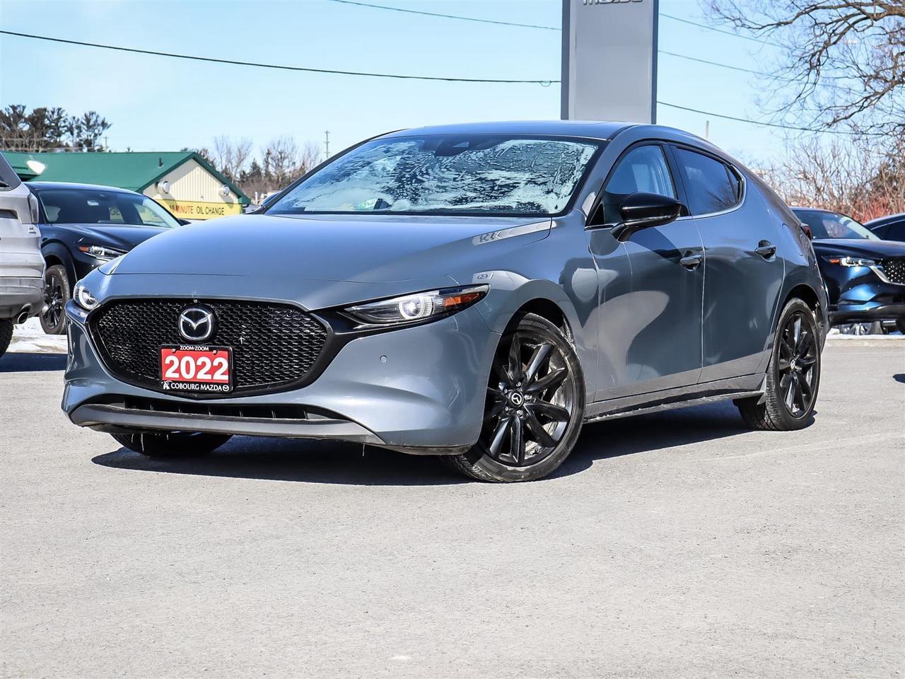 <html><body><p data-end=427 data-start=0>The <strong data-end=33 data-start=4>2022 Mazda 3 GT Turbo AWD</strong> is a premium compact sedan that blends refined design, engaging performance, and advanced technology. At its heart is the <strong data-end=213 data-start=156>Skyactiv-G 2.5 L Dynamic Pressure Turbocharged engine</strong>, paired with a 6-speed automatic and <strong data-end=284 data-start=251>i-Activ all-wheel drive (AWD)</strong>, producing <strong data-end=336 data-start=296>up to 250 hp and 320 lb-ft of torque</strong> for strong acceleration and confident passing power.</p><p data-end=978 data-start=429>Visually, the GT Turbo stands apart with <strong data-end=592 data-start=470>18-inch black finish alloy wheels, increased diameter exhaust outlets, black-mica exterior mirrors, and &ldquo;Turbo&rdquo; badges</strong>, giving it a sportier presence than non-turbo trims. Inside, it offers a <strong data-end=891 data-start=704>premium cabin with leather-trimmed seats, a 10-way power driver&rsquo;s seat with memory, Bose&reg; premium audio with 12 speakers, navigation, and a windshield-projected Active Driving Display</strong> that keeps essential info in your line of sight.</p><p data-end=1415 data-start=980>Mazda packs the GT Turbo with <strong data-end=1034 data-start=1010>advanced safety tech</strong> like Blind Spot Monitoring, Rear Cross Traffic Alert, 360&deg; View Monitor, Traffic Sign Recognition, and Traffic Jam Assist through its i-Activsense suite. All-wheel drive enhances traction in varied conditions, making this turbocharged Mazda3 as capable in poor weather as it is enjoyable on twisty roads.</p><p data-end=1636 data-start=1417>Overall, the 2022 Mazda3 GT Turbo AWD offers a compelling mix of <strong data-end=1568 data-start=1482>sporty performance, premium features, safety technology, and all-season capability</strong> in the compact sedan segment.&nbsp;</p></body></html>