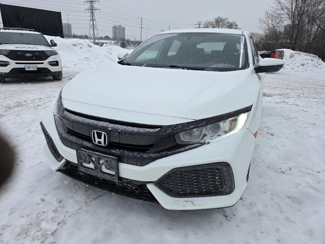 <p>This 2018 Honda Civic LX CVT Hatchback delivers a fun-to-drive experience, versatile cargo space, and everyday practicality in a stylish compact package. Powered by a fuel-efficient engine paired with a smooth continuously variable transmission (CVT), it offers responsive performance and excellent fuel economy for city commuting and highway driving alike. The hatchback body style provides generous cargo capacity with a convenient rear liftgate and 60/40 split-folding rear seats, making it easy to transport gear, groceries, or larger items. The LX trim features a well-appointed interior with comfortable cloth seating, air conditioning, power windows and locks, cruise control, push-button start, keyless entry, and a multifunction steering wheel with integrated audio controls. Technology highlights include a user-friendly infotainment system with touchscreen display, Bluetooth connectivity, USB input, and quality audio for an enjoyable ride. Exterior design elements include sleek modern lines, alloy wheels, and stylish lighting that complement the Civics athletic stance. Hondas strong reputation for safety and reliability is supported by standard features such as a rearview camera, stability and traction control, ABS brakes, and multiple airbags to help provide peace of mind for you and your passengers. A well-rounded hatchback that combines efficiency, versatility, comfort, and Honda engineering in a dynamic and practical daily driver.</p>