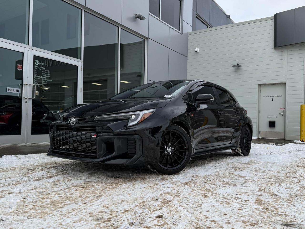 Experience sporty sophistication with this pre-owned 2025 Toyota GR Corolla in sleek Black. Powered by a turbocharged 1.6L 3-cylinder engine paired with the Gazoo Racing Direct Shift 6-speed manual transmission and full-time AWD, it delivers thrilling performance and confident handling. Step inside to heated front sport seats with GR Sport fabric and suede trim, complemented by an 8 multimedia touchscreen with JBL audio for immersive entertainment. Safety and driver convenience are front and center with advanced features like front and rear parking sensors, lane departure prevention, and a rearview camera. With black 18 matte alloy wheels and aggressive styling, this GR Corolla perfectly blends performance and style. Dont miss your chancecontact us today to drive home this exciting all-wheel-drive sport hatch!Go Mazda is an AMVIC licensed business.Clean CarFax