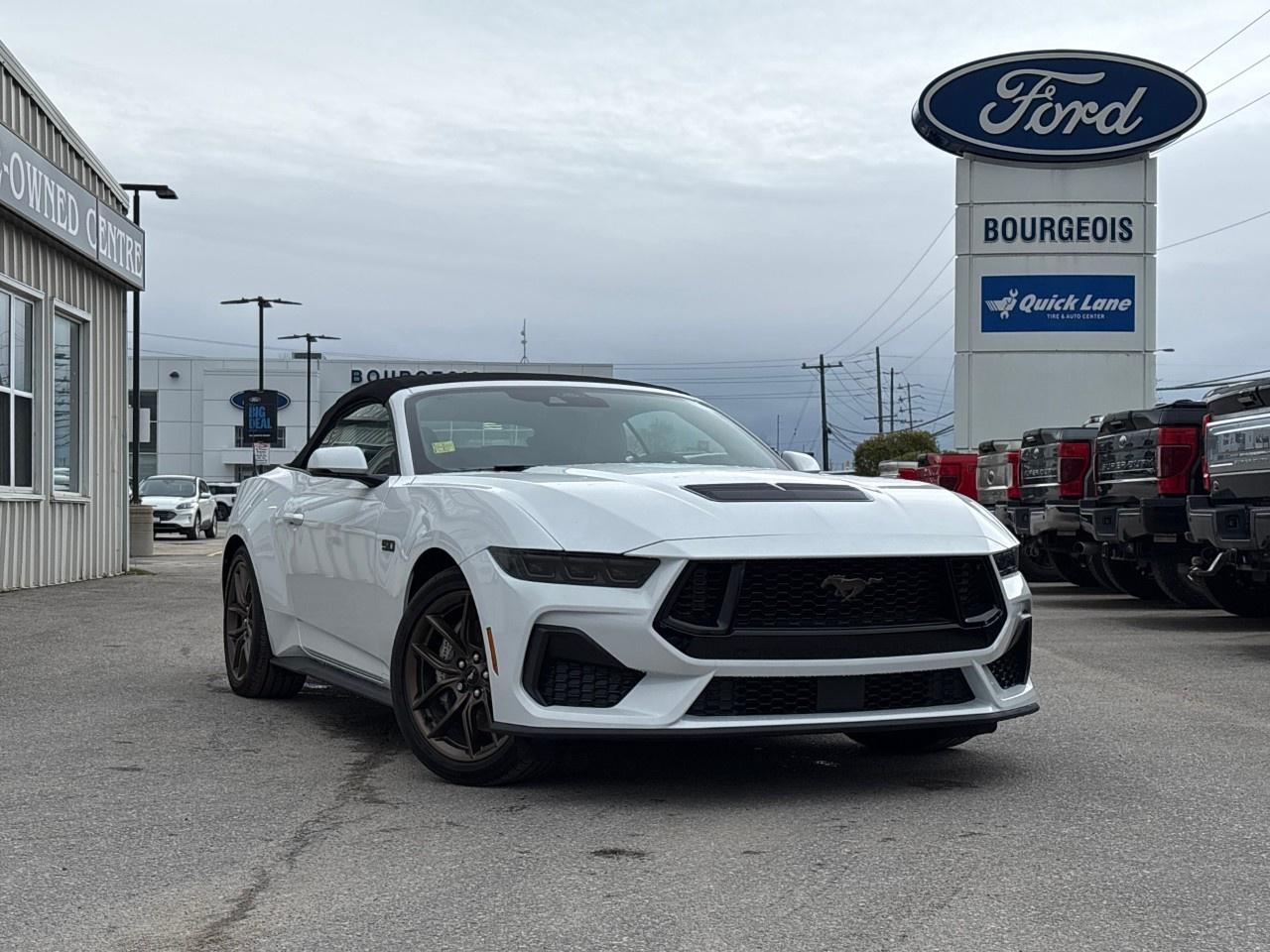 <p>The 2026 Ford Mustang GT Premium Convertible in a stunning white shade is a rear-wheel-drive marvel offering unmatched driving excitement. Known for its legendary handling, this new model features a dynamic combination of style and performance.</p><p>Its sleek convertible design is complimented by alloy wheels that add to its distinguished appearance, while the gray interior boasts refined leatherette door trim and a driver-focused cockpit. Features like the heated and cooled front seats ensure comfort in any weather.</p><p>Equipped with the latest tech innovations, the Mustang comes with a Magnesium Framed Panoramic Curved Display to enhance your driving experience. Safety is prioritized with Ford Co-Pilot360 Assist+, offering Adaptive Cruise Control, lane centering assist, Blind Spot Assist, and more. These features work seamlessly to keep you secure and make each drive safer and more enjoyable.</p><p>Whether you're a performance enthusiast drawn to its 6-speed manual transmission and exhilarating RWD setup or you're seeking a convertible experience with premium features, this Mustang is tailored for you. Contact our dealership today for further details or to arrange a test drive.</p> <p><span style=color:rgb( 58 , 80 , 95 )>The discount shown on vehicle represents the </span><u>Cash Purchase</u><span style=color:rgb( 58 , 80 , 95 )> discount and is inclusive of all non-stackable and stackable cash purchase discounts from Ford of Canada and Bourgeois Motors Ltd. and is offered in lieu of sub-vented lease or finance rates. To get details on current discounts applicable to this and other vehicles in our inventory for Lease and Finance customer, see a member of our team. All offers for lease or finance are On Approved Credit (OAC).While every effort is made to ensure the accuracy of discounts and programs, programs are subject to change without notice </span><span style=color:rgb( 119 , 119 , 119 )>and may not be accurate or completely current. While every reasonable effort is made to ensure the accuracy of this data, we are not responsible for any errors or omissions contained on these pages.</span></p> <p><strong>Why Choose the Bourgeois Auto Group?</strong></p><p>For 80 years, Bourgeois Auto Group has been delivering exceptional automotive experiences. Our factor trained teams work to ensure you receive the shopping experience you deserve; whether you're looking for a new or new-to-you vehicle.</p><p>Shop 24/7 with our online showroom and chat service, ensuring convenience every step of the way. No hidden fees, full disclosure, and every pre-owned vehicle comes with a Carfax® report for peace of mind.</p><p>We offer a wide selection of pre-owned vehicles, all competitively priced using real-time market data. Get the best deal on your purchase and trade-in with our free Live Market Analysis report.</p><p>Looking to sell your car? We buy any make or modelno purchase required. Our simple to use online trade valuation tool will provide you with a clear, transparent selling experience whether you buy our car or not.</p><p>Backed by hundreds dedicated employees across 4 convenient locations, were here to meet all your automotive needs. Visit us in Midland or Parry Sound and explore our inventory or schedule your next service today.</p> <p><strong>Financing Your Next Vehicle with Bourgeois Motors Ford in Midland:</strong></p><p>At Bourgeois Motors Ford, we make financing your next vehicle simple and stress-free! Our team works with trusted lenders to find flexible options tailored to your budget. Drive away with confidenceapply today!</p><p>Take advantage of our online pre-qualification tool, backed by Equifax and TD Bank to find the payment that works for you. Simply <a href=https://www.bourgeoismotors.com/free-credit-check/ rel=nofollow><strong>CLICK HERE</strong></a><strong> </strong>to use our secure online credit tool with no impact to your credit.</p>