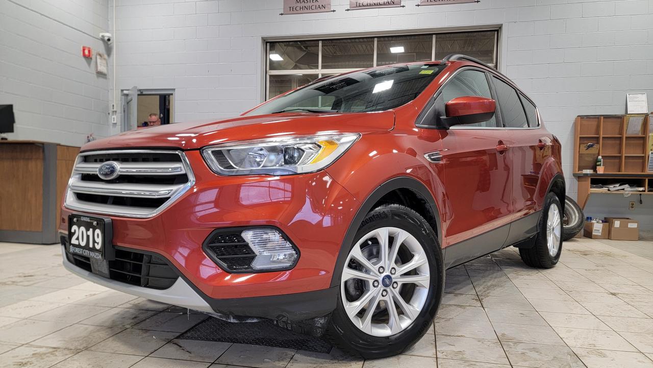 2019 Ford Escape SEL  Well-Equipped, Comfortable, and Reliable<br><br>This 2019 Ford Escape SEL is a versatile and dependable SUV thats perfect for daily driving or weekend getaways. It offers a smooth ride, strong fuel efficiency, and a comfortable interior packed with convenient features.<br><br>Key Features Include:<br><br>1.5L EcoBoost® turbocharged engine<br><br>Automatic transmission<br><br>Front-wheel drive (or AWD, if applicable)<br><br>Leather-trimmed seats<br><br>Power drivers seat<br><br>Heated front seats<br><br>Dual-zone automatic climate control<br><br>SYNC® infotainment system with touchscreen display<br><br>Apple CarPlay® & Android Auto compatibility<br><br>Bluetooth® hands-free connectivity<br><br>Rearview camera<br><br>Keyless entry with push-button start<br><br>Alloy wheels<br><br>Roof rails for extra cargo capability<br><br>The Escape SEL delivers a spacious cabin, ample cargo room, and modern technology, making it a great choice for families, commuters, or anyone looking for a practical SUV with upscale touches. Clean, comfortable, and ready for the road.