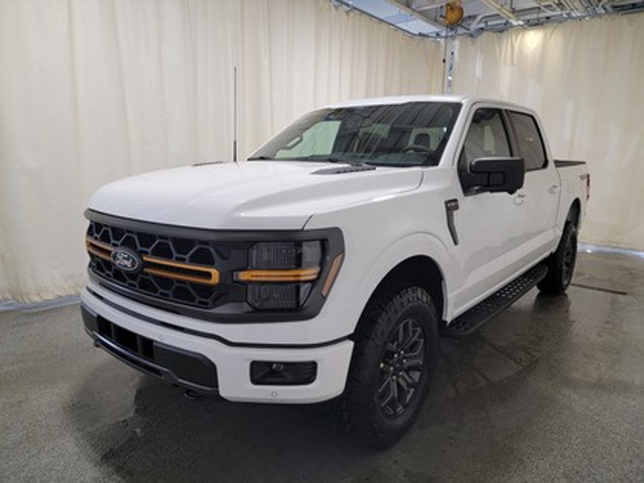 The all-new 2026 Ford F-150 Tremor 401A looks absolutely stunning in Oxford White. This pickup comes with the 3.5L EcoBoost® engine, delivering an impressive 400 horsepower and 500 lb-ft of torque. With EcoBoost® technology and a 10-speed automatic transmission, this truck achieves a highway/city fuel economy of 12.9L/100km (22 miles per gallon) combined highway/city. 

Key Features:
Selectable Drive Modes
18 Alloy W/ Dark Matte Finish Wheels
Heated Front Seats
Ford Co-Pilot 360 Assist 2.0
Adaptive Cruise Control
Lane Centering
Evasive Steering Assist
Front Parking Sensors
Pro Trailer Backup Assist
Pro Trailer Hitch Assist
BlueCruise
8 Speaker B&O Sound System
Hill Descent Control
Remote Start System
Engine Block Heater

This vehicle comes with the All-Weather Packageready to take on any season!
Snow, rain, mud, or sunshinethis vehicle is built for it all! The All-Weather Package adds extra protection where it matters most, with premium mud flaps to shield your paint from road debris, all-weather floor mats to protect your interior from lifes messes, and Xpel paint protection to help guard against those infuriating rock chips. Drive with confidence, knowing your investment is protected from Regina's elements.
 
Bennett Dunlop Ford, proudly serving Regina for over 40 years, is conveniently located at 770 Broad Street. With over 3,500 Google reviews, our reputation reflects our commitment to providing a fast, easy, and enjoyable vehicle-buying experience. We eliminate the hassle with no admin or documentation fees, transparent upfront pricing that lets you shop with total confidence. But were more than just a dealershipwere driven to make a difference by supporting local community initiatives and events that matter to you. Visit Bennett Dunlop Ford today and experience why were Reginas trusted choice for quality vehicles, exceptional service, and a genuine commitment to driving change in our community!