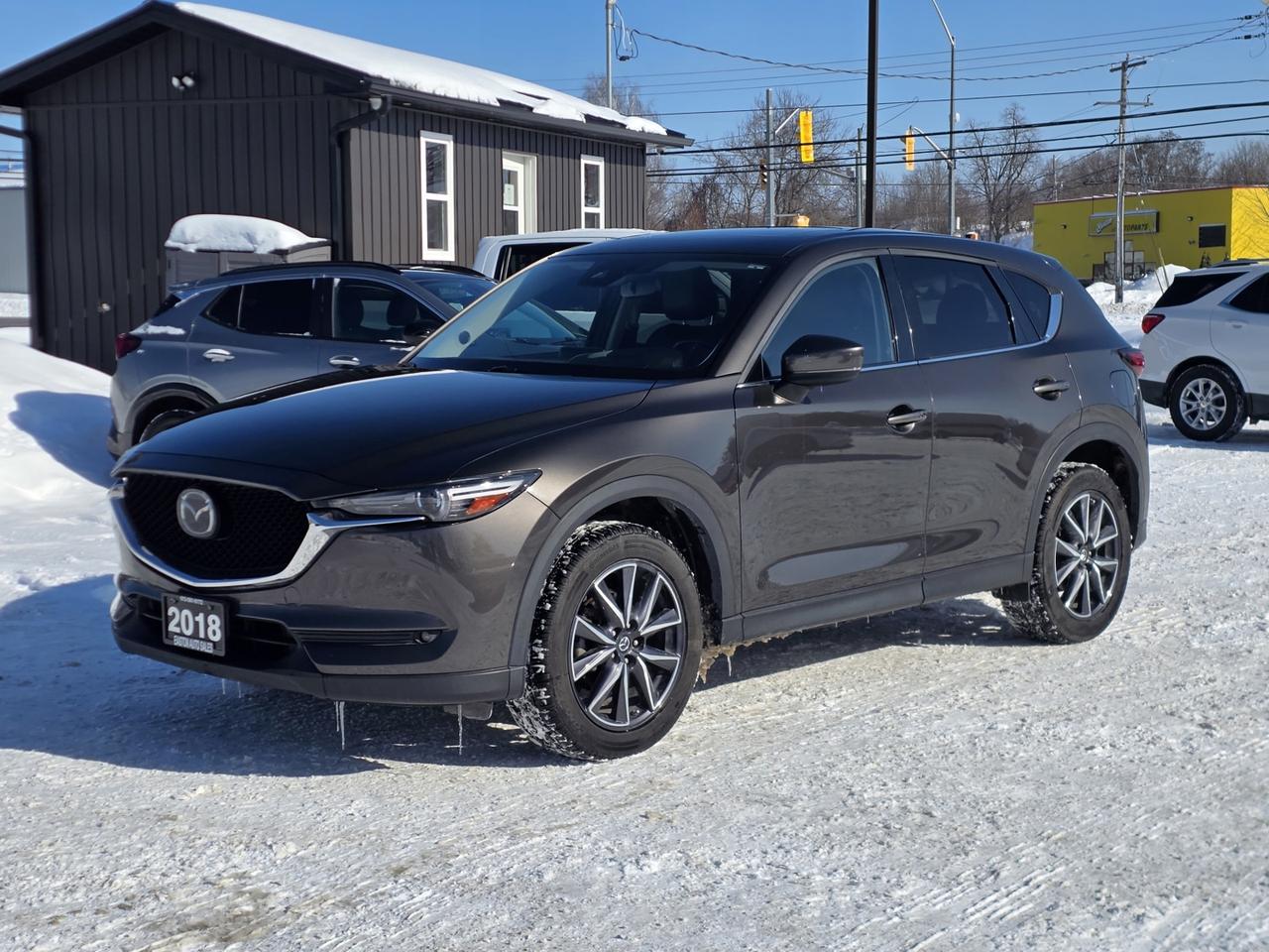 <p><span>Meet the perfect blend of style, comfort, and confidence on the road this </span><strong>2018 Mazda CX-5 GT AWD</strong><span> is a standout SUV that delivers premium features with Mazdas signature driving enjoyment.</span></p><div><p>Powered by a responsive <strong>2.5L 4-cylinder engine</strong> and equipped with <strong>all-wheel drive</strong>, this CX-5 is ready for all seasons. The refined interior features <strong>leather seating</strong>, a <strong>power sunroof</strong>, <strong>heated front and rear seats</strong>, and a <strong>heated steering wheel</strong>, making every drive comfortable no matter the weather. Both the driver and passenger enjoy <strong>power-adjustable seats with memory</strong>, while <strong>dual-zone climate control</strong> keeps everyone happy.</p><p>Technology and safety are front and center with a <strong>Heads-Up Display</strong>, <strong>navigation system</strong>, <strong>adaptive cruise control</strong>, <strong>lane keeping assist</strong>, <strong>lane departure warning</strong>, <strong>blind spot monitoring</strong>, and a <strong>back-up camera</strong>. Stay connected with <strong>Bluetooth</strong>, <strong>smart device integration</strong>, steering wheel controls, and a <strong>premium sound system</strong>. Exterior highlights include <strong>LED headlights</strong>, <strong>heated mirrors</strong>, <strong>rain-sensing wipers</strong>, and a convenient <strong>power liftgate</strong>.</p><p>This CX-5 GT is a well-rounded, upscale SUV thats as practical as it is enjoyable to drive.</p><p> <strong>Call us today to schedule a test drive!</strong><br><strong>Easton Auto Sales</strong> | <strong>613-561-5172</strong><br>OMVIC Certified UCDA Member<br>Located just minutes from <strong>Kingston and Brockville</strong><br>We pay <strong>top dollar for trades</strong><br> Check out our <strong>5-star Google rating</strong> </p><p>This one wont last long come see it for yourself! </p></div>