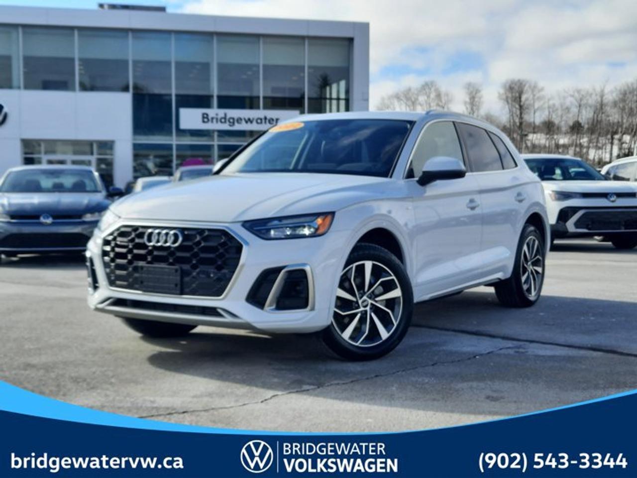 !New Price! 2022 Audi Q5 45 Progressivquattro | Apple CarPlay | Android Auto | Sirus XM Certified.This vehicle is a Steele Certified Pre-Owned Vehicle, offering added confidence through enhanced inspection standards and dealership-backed benefits. Steele Certified Reconditioning Process: Comprehensive multi-point inspection Mechanical and cosmetic reconditioning completed as needed Brake, tire, and battery assessment Professional detailing Final quality control road test Steele Certified Pre-Owned vehicles include additional ownership benefits. Any concerns related to the certification process must be reviewed and addressed by the original selling dealer.CARFAX Canada One Owner CARFAX Canada Low Kilometer Odometer is 28016 kilometers below market average!White quattro 7-Speed Automatic S tronic 2.0L 4-Cylinder TFSI Black Leather, 10 Speakers, 4-Wheel Disc Brakes, 5.302 Axle Ratio, ABS brakes, Air Conditioning, Alloy wheels, AM/FM radio: SiriusXM, Auto High-beam Headlights, Auto-dimming door mirrors, Auto-dimming Rear-View mirror, Automatic temperature control, Brake assist, Compass, Delay-off headlights, Driver door bin, Driver vanity mirror, Dual front impact airbags, Dual front side impact airbags, Electronic Stability Control, Emergency communication system: Audi connect Security and Assistance, Exterior Parking Camera Rear, Four wheel independent suspension, Front anti-roll bar, Front Bucket Seats, Front dual zone A/C, Front fog lights, Front reading lights, Garage door transmitter: HomeLink, Heated door mirrors, Heated Front Bucket Seats, Heated front seats, Heated steering wheel, Illuminated entry, Leather Seating Surfaces, Leather Shift Knob, Leather steering wheel, Low tire pressure warning, Memory seat, Navigation system: MMI Navigation plus, Occupant sensing airbag, Outside temperature display, Overhead airbag, Overhead console, Panic alarm, Passenger door bin, Passenger vanity mirror, Power door mirrors, Power driver seat, Power Liftgate, Power moonroof, Power passenger seat, Power steering, Power windows, Radio data system, Radio: MMI Navigation Plus w/SiriusXM Satellite, Rain sensing wipers, Rear air conditioning, Rear anti-roll bar, Rear fog lights, Rear reading lights, Rear window defroster, Rear window wiper, Remote keyless entry, Roof rack, Security system, Speed control, Speed-sensing steering, Speed-Sensitive Wipers, Split folding rear seat, Spoiler, Steering wheel mounted audio controls, Tachometer, Telescoping steering wheel, Tilt steering wheel, Traction control, Trip computer, Turn signal indicator mirrors, Variably intermittent wipers, Wheels: 8.0J x 19 5-Twin-Arm Design.