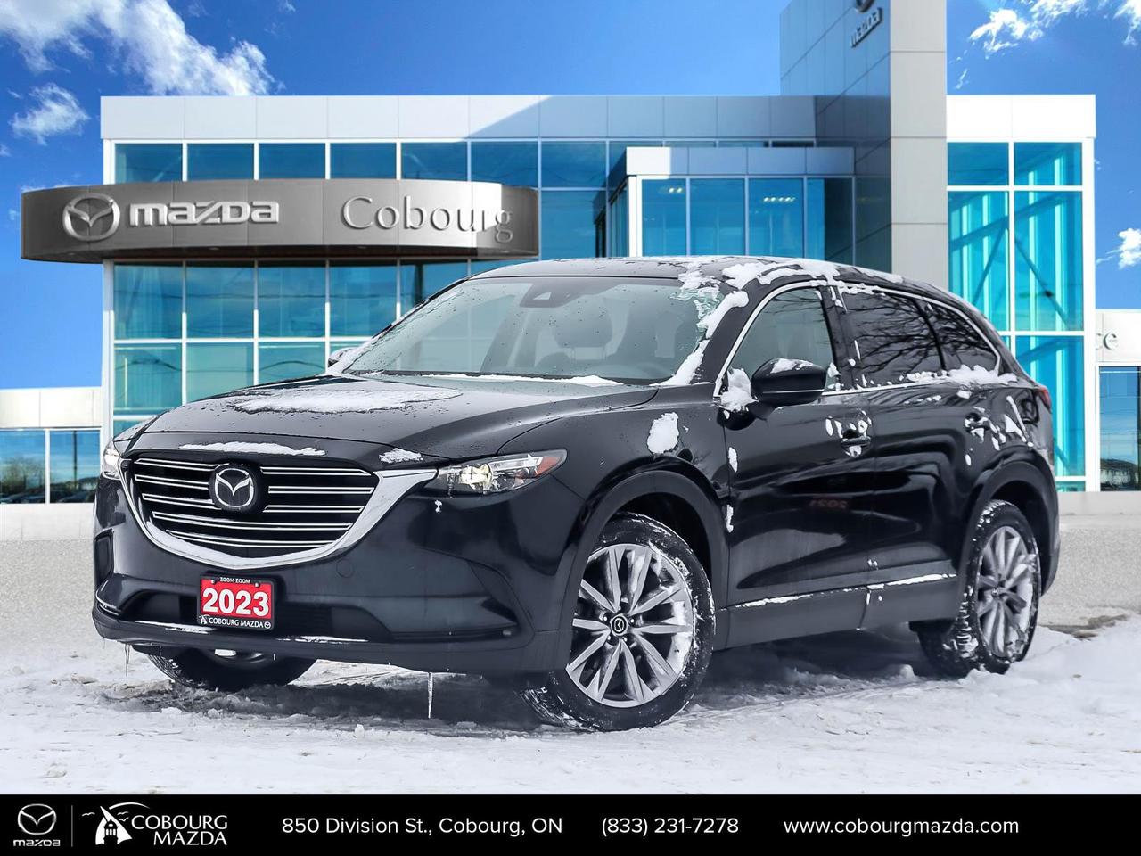 <html><body><p data-end=733 data-start=143>The <strong data-end=175 data-start=147>2023 Mazda CX-9 GS-L AWD</strong> is a refined three-row crossover SUV designed for families who want both capability and sophistication. At its heart is a <strong data-end=356 data-start=298>2.5-litre turbocharged Skyactiv-G four-cylinder engine</strong> paired with a smooth <strong data-end=412 data-start=378>6-speed automatic transmission</strong> and full-time <strong data-end=446 data-start=427>all-wheel drive</strong>, delivering confident traction in varied weather and road conditions typical of Canadian seasons. It seats up to <strong data-end=576 data-start=560>7 passengers</strong> with generous cargo space behind the third row, making it practical for daily use, road trips, and weekend adventures.</p><p data-end=1202 data-start=735>The GS-L trim elevates the CX-9 experience with <strong data-end=807 data-start=783>20-inch alloy wheels</strong>, a <strong data-end=843 data-start=811>power-operated rear liftgate</strong>, <strong data-end=856 data-start=845>sunroof</strong>, leather upholstery, and heated second-row seats for added comfort. Inside, you&rsquo;ll find a <strong data-end=982 data-start=947>10.25-inch infotainment display</strong> with Apple CarPlay/Android Auto compatibility and <strong data-end=1060 data-start=1033>wireless phone charging</strong> &mdash; plus thoughtful conveniences like an <strong data-end=1132 data-start=1100>auto-dimming rearview mirror</strong> and <strong data-end=1163 data-start=1137>advanced keyless entry</strong>.</p><p data-end=1552 data-start=1204>Standard safety tech includes blind-spot monitoring, rear-cross traffic alert, lane-keep assist, and adaptive cruise control, giving peace of mind on long drives and city commutes alike. Overall, the 2023 CX-9 GS-L AWD blends engaging driving dynamics with family-friendly versatility and upscale appointments.</p></body></html>