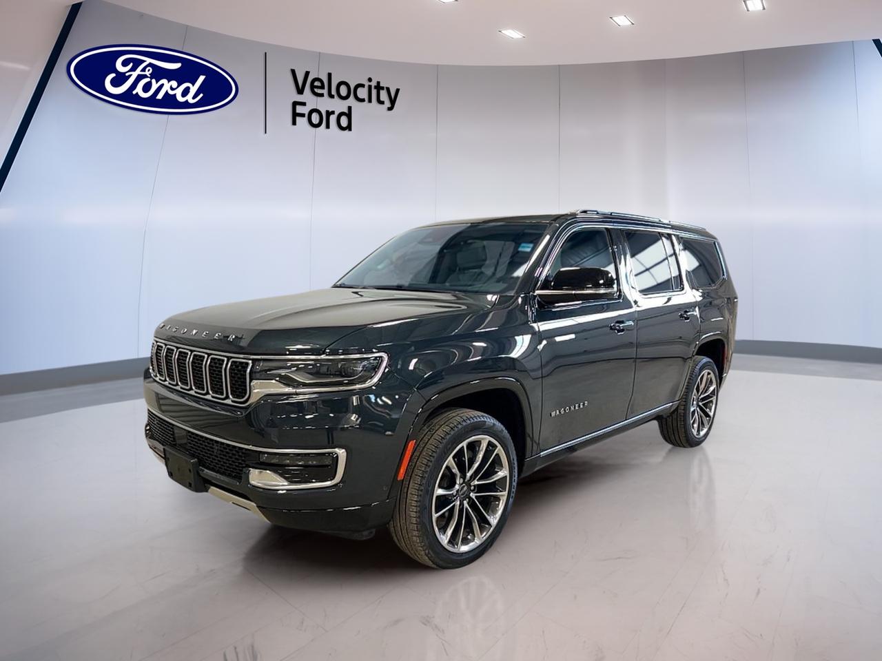 Meet the SUV that makes every trip feel planned, even when it is not. This used 2023 Jeep Wagoneer Series III 4x4 in Blue with a Black interior brings full-size comfort, confident four-wheel drive, and modern tech to Moose Jaw. With 29,093 km, an automatic transmission, and a 3.0-litre gas engine, it is ready for family road trips, winter commutes, and weekend getaways. Offered by Velocity Ford, it delivers the space and features buyers want in a premium Jeep SUV.

The 2023 Jeep Wagoneer Series III 4x4 gives you a calm, controlled drive with smart convenience built in. Enjoy push-button start and a remote starter for cold mornings. The power liftgate and rear trunk access make loading easy after shopping or hockey practice. With tinted windows, side steps, and LED headlamps, it also brings a clean, upscale look that fits right in anywhere in Saskatchewan.

FEATURES OF THE Wagoneer Series III 4x4  
»» Four-wheel drive for confident traction  
»» Power liftgate for easier loading  
»» Navigation system for guided travel  
»» Heated front and rear seats  

ADVANCED SAFETY FEATURES  
»» Anti-lock braking system for controlled stops  
»» Stability control helps maintain steady handling  
»» Blind spot monitor for safer lane changes  
»» Lane departure warning adds extra awareness  

PERFORMANCE AND EFFICIENCY  
»» 3.0-litre gas engine for smooth power  
»» 8-speed automatic transmission shifts smoothly  
»» Limited slip differential improves low-traction grip  
»» Four-wheel drive supports winter-ready capability  

COMFORT AND CONVENIENCE  
»» Dual-zone automatic climate control for comfort  
»» Rear climate control for second-row comfort  
»» Memory seats and adjustable pedals convenience  
»» Power windows and power steering ease  

TECHNONOLGY AND CONNECTIVITY  
»» Navigation system helps you stay on route  
»» Bluetooth integration for hands-free calling  
»» WiFi hotspot helps keep passengers connected  
»» Satellite radio and HD Radio variety  

CARGO SPACE  
»» Power liftgate speeds up loading  
»» Rear trunk access simplifies daily errands  
»» Four doors for easy entry  
»» Spare tire carried for added reassurance  

WHAT OTHER OWNERS LIKE  
»» Confident visibility from a higher ride  
»» Strong road-trip comfort for families  
»» Helpful driver aids reduce daily stress  
»» Easy-to-use infotainment and connectivity  

This 2023 Jeep Wagoneer Series III 4x4s VIN is: 1C4SJVDP4PS503328.