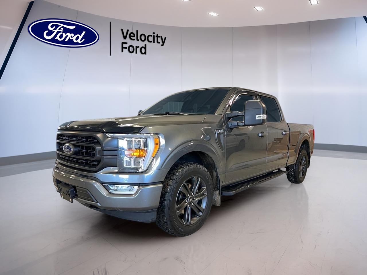// SINGLE OWNER! //

Meet the 2022 Ford F-150 XLT SuperCrew 6.5 Box, now at Velocity Ford in Moose Jaw. This grey, 4-door truck pairs a proven 3.5 L gas engine with an automatic transmission for smooth, confident driving. CARFAX Canada reports a single owner, and it shows in how well it presents.

With 72,590 km, this 2022 Ford F-150 XLT SuperCrew 6.5 Box is ready for work, weekends, and winter roads. You get the space of a SuperCrew cab, the added utility of the 6.5 box, and the confidence of Four-Wheel Drive (4WD). Its a practical truck that fits real Saskatchewan life.

TRUCK FEATURES  
»» Towing capacity rated at 4,671 kg  
»» Four-Wheel Drive for tough conditions  
»» Rear tow hook for recovery help  
»» Off-road tires for added grip  

ADVANCED SAFETY FEATURES  
»» Anti-Lock Braking System helps maintain steering  
»» Stability Control supports confident handling  
»» Side impact airbags for added protection  
»» Blind Spot Monitor helps change lanes  

PERFORMANCE AND EFFICIENCY  
»» 3.5 L gas engine power  
»» Automatic transmission for smooth shifting  
»» Dual shift mode for driver control  
»» Power steering for easy low-speed turns  

COMFORT AND CONVENIENCE  
»» Front air conditioning for cabin comfort  
»» Power windows for quick adjustments  
»» Cruise control for relaxed highway drives  
»» Adjustable steering wheel for better fit  

TECHNONOLGY AND CONNECTIVITY  
»» Navigation system helps plan every route  
»» Bluetooth integration for hands-free calling  
»» Steering wheel audio controls keep focus  
»» WiFi hotspot helps keep devices connected  

CARGO SPACE  
»» 6.5 box for longer cargo  
»» Rear trunk access for added usability  
»» Spare tire ready for the unexpected  
»» Tinted windows help protect interior items  

AWARDS & RECOGNITIONS  
»» Best Buy Award, Kelley Blue Book, 2022  

WHAT OTHER OWNERS LIKE  
»» Strong towing and everyday hauling ability  
»» Confident 4WD traction in poor weather  
»» Easy-to-use tech and Bluetooth pairing  
»» Comfortable ride for long commutes  

This 2022 Ford F-150 XLT SuperCrew 6.5 Box keeps it simple in the best way: the right engine, the right cab size, and the right equipment for daily driving and real work. It also includes helpful details like heated mirrors, fog lights, automatic headlights, a backup camera, lane departure warning, tire pressure monitoring, and satellite radio for day-to-day ease.

This 2022 Ford F-150 XLT SuperCrew 6.5 Boxs VIN is: 1FTFW1E85NFA38258.