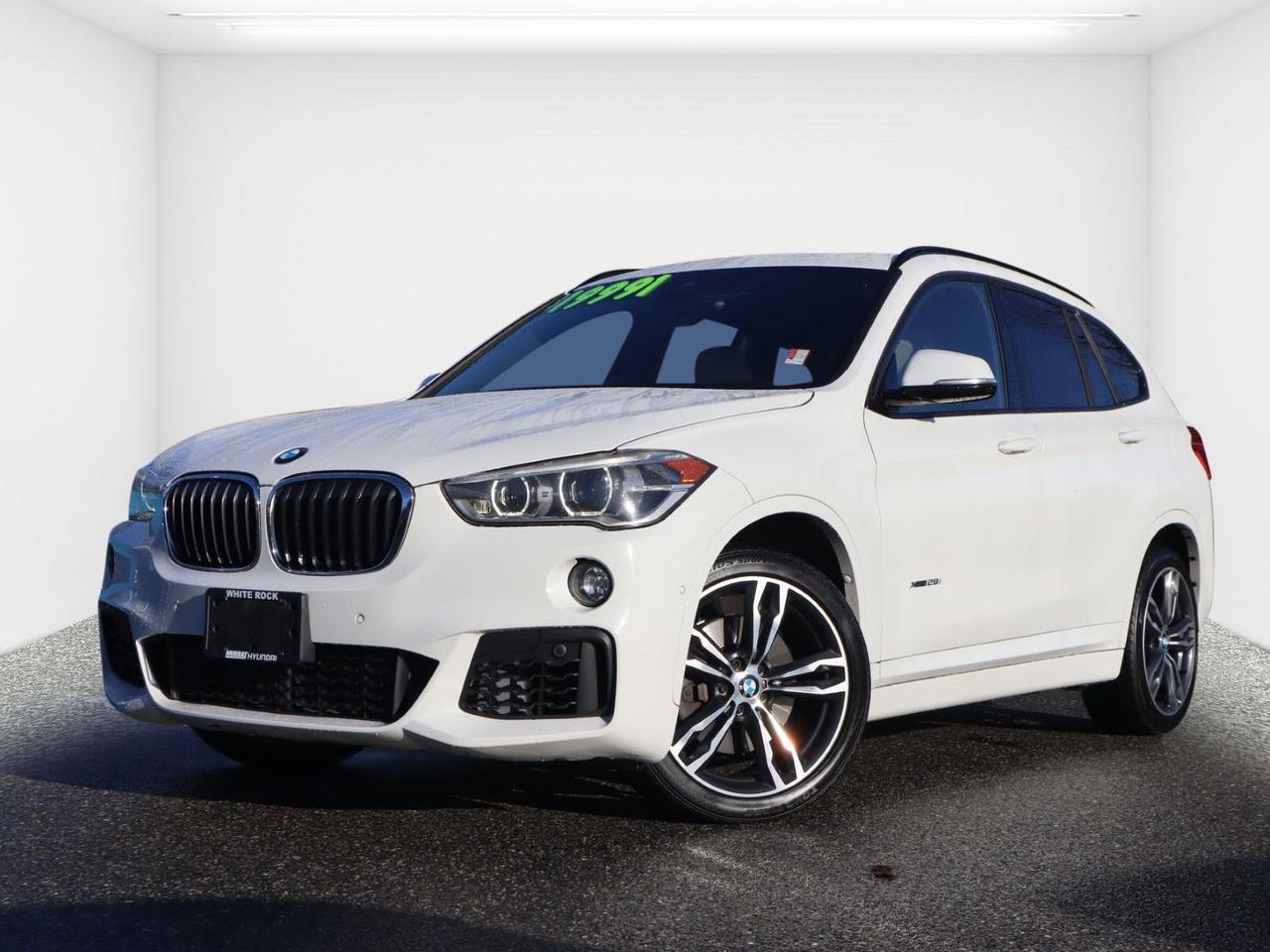 2017 BMW X1 xDrive28i AWD M Sport Package | Navigation | Panoramic Sunroof | Head-Up Display<br><br>AWD Luxury SUV | TwinPower Turbo | Premium Enhanced Package | Executive Package | Heated Steering Wheel | Keyless Entry | Apple CarPlay | Parking Assist | Lane Departure Warning<br><br>Now available at Murray Hyundai White Rock, this 2017 BMW X1 xDrive28i AWD is a premium compact luxury SUV that blends sport performance, advanced technology, and everyday practicality.<br><br>Finished in White and powered by a 2.0L 4-Cylinder DOHC 16V TwinPower Turbo engine, paired with an 8-Speed Automatic Transmission and BMWs intelligent xDrive All-Wheel Drive (AWD) system, this BMW X1 delivers responsive handling, confident traction, and impressive fuel efficiency.<br>With 12,962 KM below market average, this low-kilometre BMW X1 offers exceptional value in the luxury SUV segment.<br>________________________________________<br>M Sport Package  Performance & Styling Upgrade<br>âM Aerodynamic Body Styling<br>âSport Seats<br>âM Leather Steering Wheel<br>âSport Suspension<br>âAluminum Trim Accents<br>________________________________________<br>Premium & Executive Package Features<br>âHead-Up Display<br>âNavigation System with iDrive<br>âPanoramic Glass Sunroof<br>âLeather Interior<br>âHeated Steering Wheel<br>âPower Tailgate<br>âComfort Access Keyless Entry<br>âPush Button Start<br>âSmart Device Integration (Bluetooth / Apple CarPlay Compatible)<br>âPremium Sound System<br>________________________________________<br>Safety & Driver Assistance<br>âBackup Camera<br>âFront & Rear Parking Sensors<br>âAutomatic Parking Assist<br>âLane Departure Warning<br>âDynamic Cruise Control<br>âStability & Traction Control<br>âBMW Advanced Airbag System<br>________________________________________<br>The 2017 BMW X1 xDrive28i AWD M Sport is ideal for drivers searching for:<br> BMW X1 for sale in White Rock<br> AWD luxury SUV near Vancouver<br> Compact premium crossover<br> BMW M Sport SUV<br> Reliable used BMW with low kilometres<br>Sporty, efficient, and loaded with technology, this BMW X1 is ready for its next owner.<br>________________________________________<br>Why Buy From Murray Hyundai White Rock?<br> 7x Hyundai Presidents Award of Merit Winner<br> 3x Consumer Choice Award for Business Excellence<br> AutoTrader Dealer of the Year<br><br>M-Promise Certified Pre-Owned ($995 Value Included):<br>â30-Day / 2,000 KM Exchange Program<br>â3-Day / 300 KM Money Back Guarantee<br>â144-Point Mechanical Inspection<br>âFull Synthetic Oil Change<br>âBC Verified CarFax<br>âMinimum 6-Month Powertrain Warranty<br><br>All vehicles are competitively priced below market value to ensure a transparent, hassle-free car buying experience.<br><br> Visit Murray Hyundai White Rock today to test drive this 2017 BMW X1 xDrive28i AWD.<br><br>All vehicle purchases are subject to a $799 administration fee. Dealer #31129.<br><br><br>