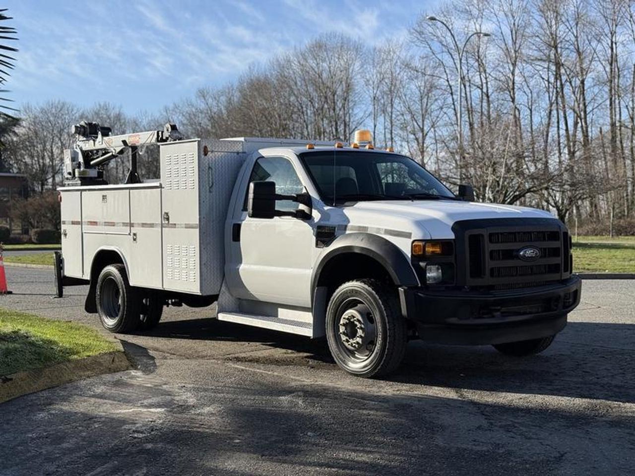 This 2009 Ford F-550 XL Super Duty diesel service truck is powered by a 6.4L Power Stroke V8 paired with an automatic transmission and rear-wheel drive, and is equipped with an IMT crane (Model 3203i) rated at a 2,000 lb lifting capacity. It features a service body with multiple storage compartments, along with auxiliary switches, beacon light, and a backup camera to support job-site operation. Additional equipment includes cruise control, tow/haul mode, fog lights, air conditioning and heat, and an AM/FM radio. Finished in white with a grey cloth interior, this truck offers a practical and straightforward setup for service, utility, or fleet use. This item is currently OFFSITE. You must register an appointment with our office to schedule an offsite viewing. Appointments must be made a minimum of one business day in advance (and as defined by the days that Repo.com is open for business) before your appointment can be scheduled and confirmed. We may, at our own discretion, instead opt to transport smaller items to Repo.coms main yard for viewing purposes.  $38,880.00 plus $375 processing fee, $39,255.00 total payment obligation before taxes.   Listing report, warranty, contract commitment cancellation fee, financing available on approved credit (some limitations and exceptions may apply). All above specifications and information is considered to be accurate but is not guaranteed and no opinion or advice is given as to whether this item should be purchased. We do not allow test drives due to theft, fraud, acts of vandalism and undetectable impaired driving. Instead we provide the following benefits: Complimentary Warranty (with options to extend), Limited Money Back Satisfaction Guarantee on Fully Completed Contracts, Contract Commitment Cancellation, and an Open-Ended Sell-Back Option. Ask seller for details or call 604-522-REPO(7376) to confirm listing availability.