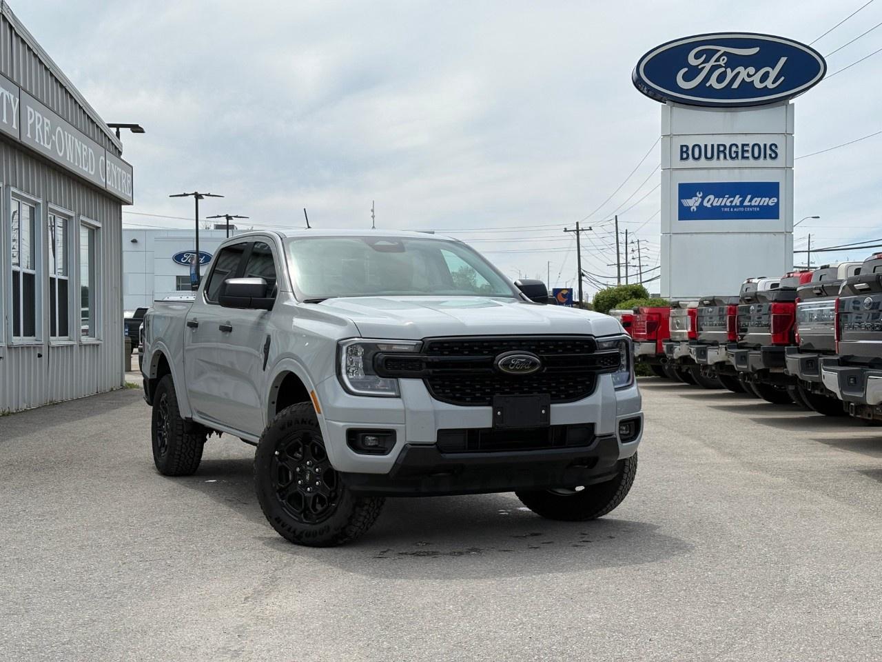 <p>The 2026 Ford Ranger XLT in its stunning gray finish combines robust power with refined handling, making it an excellent choice for those seeking capability and style. This 4x4 drive is ready to tackle any terrain, offering you the confidence you need on every journey.</p> <p>The Ranger's exterior is highlighted by features like the power sliding rear window and privacy glass, adding practicality and a hint of privacy. Dual-zone electronic temperature control ensures a comfortable interior for both the driver and passengers, while the SuperCrew configuration provides plenty of space for all.</p> <p>Technology enthusiasts will appreciate the 12" centre display, which, alongside infotainment options like satellite radio, smart device integration, and a Wi-Fi hotspot, ensures connectivity on every trip. Safety is a paramount concern, with lane assist, a backup camera, and parking sensors helping you navigate with ease. Additional comforts include heated seats, making those cold Canadian winters a bit more bearable.</p> <p>This truck is perfect for adventure seekers who require power and convenience, equipped with trailer tow capabilities and a 2.3L EcoBoost engine. Whether you're hauling gear or hitting the road for a camping trip, the Ford Ranger XLT is your trustworthy companion. Reach out to our dealership to arrange a test drive and experience the power and practicality of the new Ranger today!</p> <p><span style=color:rgb( 58 , 80 , 95 )>The discount shown on vehicle represents the </span><u>Cash Purchase</u><span style=color:rgb( 58 , 80 , 95 )> discount and is inclusive of all non-stackable and stackable cash purchase discounts from Ford of Canada and Bourgeois Motors Ltd. and is offered in lieu of sub-vented lease or finance rates. To get details on current discounts applicable to this and other vehicles in our inventory for Lease and Finance customer, see a member of our team. All offers for lease or finance are On Approved Credit (OAC).While every effort is made to ensure the accuracy of discounts and programs, programs are subject to change without notice </span><span style=color:rgb( 119 , 119 , 119 )>and may not be accurate or completely current. While every reasonable effort is made to ensure the accuracy of this data, we are not responsible for any errors or omissions contained on these pages.</span></p> <p><strong>Why Choose the Bourgeois Auto Group?</strong></p><p>For 80 years, Bourgeois Auto Group has been delivering exceptional automotive experiences. Our factor trained teams work to ensure you receive the shopping experience you deserve; whether you're looking for a new or new-to-you vehicle.</p><p>Shop 24/7 with our online showroom and chat service, ensuring convenience every step of the way. No hidden fees, full disclosure, and every pre-owned vehicle comes with a Carfax® report for peace of mind.</p><p>We offer a wide selection of pre-owned vehicles, all competitively priced using real-time market data. Get the best deal on your purchase and trade-in with our free Live Market Analysis report.</p><p>Looking to sell your car? We buy any make or modelno purchase required. Our simple to use online trade valuation tool will provide you with a clear, transparent selling experience whether you buy our car or not.</p><p>Backed by hundreds dedicated employees across 4 convenient locations, were here to meet all your automotive needs. Visit us in Midland or Parry Sound and explore our inventory or schedule your next service today.</p> <p><strong>Financing Your Next Vehicle with Bourgeois Motors Ford in Midland:</strong></p><p>At Bourgeois Motors Ford, we make financing your next vehicle simple and stress-free! Our team works with trusted lenders to find flexible options tailored to your budget. Drive away with confidenceapply today!</p><p>Take advantage of our online pre-qualification tool, backed by Equifax and TD Bank to find the payment that works for you. Simply <a href=https://www.bourgeoismotors.com/free-credit-check/ rel=nofollow><strong>CLICK HERE</strong></a><strong> </strong>to use our secure online credit tool with no impact to your credit.</p> <p><strong>This Is a Dealer Demonstrator. </strong>Experience exceptional value with Bourgeois Motors Fords executive demos. These are like-new vehicles with low mileage, premium features, and significant savings. Drive away with confidence, backed by the balance of factory warranties and our commitment to quality. Its a great way to own a new Ford.</p>