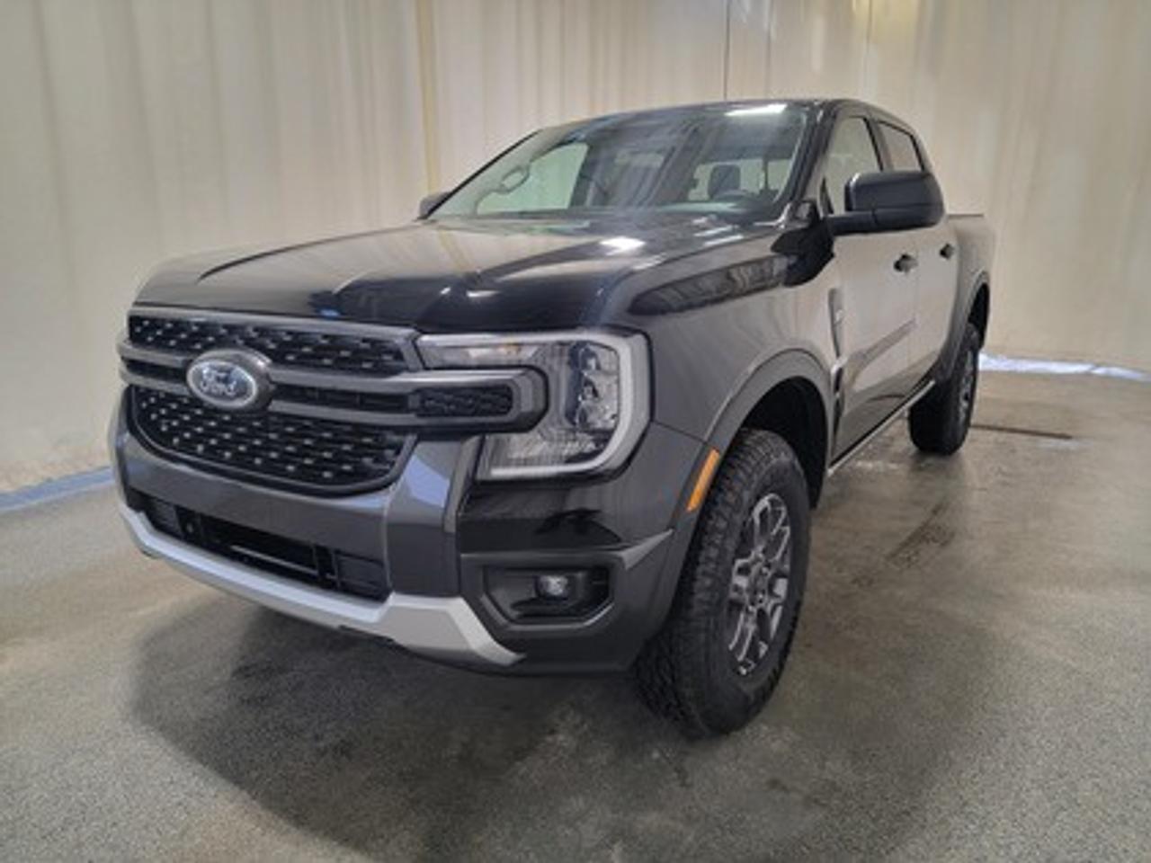This all-new 2026 Ford Ranger XLT 301A looks absolutely stunning in Shadow Black. This versatile compact pickup comes equipped with the 2.3L EcoBoost® engine, producing 270 horsepower and 310 lb-ft of torque. By leveraging EcoBoost® technology and a 10-speed automatic transmission, this truck is designed to achieve 11.2L/100 km (25 miles per gallon) combined highway/city fuel economy.

Key Features:
12 Centre Display
Dual Zone Temperature Control 
Rear Window W/Privacy Glass & Defrost
Ford Co-Pilot360
Rear View Camera
Lane Keeping System 
Rear Parking Sensors
Reverse Break Assist 
10-Way Power Drivers Seat 
Heated Front Seats 
17 Grey Painted Aluminum Wheels
Cruise Control
FordPass Connect
Selectable Drive Modes
8 Cluster Display
Advanced Towing Package
Engine Block Heater

This vehicle comes with the All-Weather Packageready to take on any season!
Snow, rain, mud, or sunshinethis vehicle is built for it all! The All-Weather Package adds extra protection where it matters most, with premium mud flaps to shield your paint from road debris, all-weather floor mats to protect your interior from lifes messes, and Xpel paint protection to help guard against those infuriating rock chips. Drive with confidence, knowing your investment is protected from Regina's elements.

Bennett Dunlop Ford, proudly serving Regina for over 40 years, is conveniently located at 770 Broad Street. With over 3,500 Google reviews, our reputation reflects our commitment to providing a fast, easy, and enjoyable vehicle-buying experience. We eliminate the hassle with no admin or documentation fees, transparent upfront pricing that lets you shop with total confidence. But were more than just a dealershipwere driven to make a difference by supporting local community initiatives and events that matter to you. Visit Bennett Dunlop Ford today and experience why were Reginas trusted choice for quality vehicles, exceptional service, and a genuine commitment to driving change in our community!