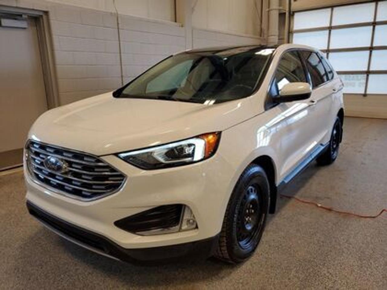 SHOWSTOPPER JUST LANDED!! Meet the 2021 Ford Edge SEL 201A AWD  powered by the ever-popular 2.0L I4 EcoBoost that delivers the perfect blend of performance and efficiency.  All-wheel drive confidence for unpredictable roads, smooth power when you need it, and SEL comfort that makes every drive feel first-class. Bold style. Smart capability. Ready to elevate your everyday.

Key Features:
Automatic High Beams
Power Driver Seat
Passenger Power Drivers Seat
Bluetooth
SYNC
Keyless Entry
Push Button Start 
Back Up Sensors
Back Up Camera 
Lane Centering
Blind Spot Warning
Auto Start Stop
Pre-Collison Assist
Power Moonroof
Heated Steering Wheel
Climate Control
Remote Start
Two Sets of Tires and Rims

After this vehicle came in on trade, we had our fully certified Pre-Owned Ford mechanic perform a mechanical inspection. This vehicle passed the certification with flying colors. After the mechanical inspection and work was finished, we did a complete detail including sterilization and carpet shampoo. 

Moose Jaw Ford, conveniently located at 1010 North Service Road in Moose Jaw, is your trusted destination for all your automotive needs. With an impressive 4.8-star Google rating from nearly 1,500 reviews, we are proud to deliver an exceptional vehicle-buying experience tailored just for you. Our Moose Jaw Motives set us apart, offering unbeatable value like half-priced oil changes for life on pre-owned vehicles, one year of key and remote protection, and one year of tire and rim protection. Enjoy peace of mind with every purchase. At Moose Jaw Ford, were committed to driving positive change in our community by combining exceptional service, high-quality vehicles, and a guest-first approach. Visit us today!