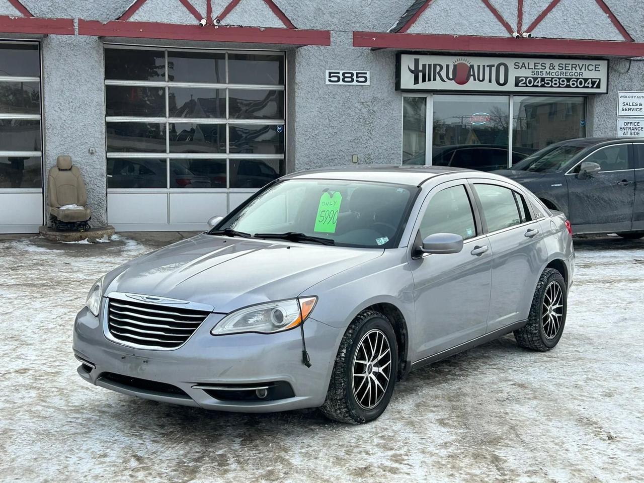 <p class=my-2 [&+p]:mt-4 [&_strong:has(+br)]:inline-block [&_strong:has(+br)]:pb-2><strong>2013 Chrysler 200 Touring &ndash; $5,990 + tax</strong><br><strong>Mileage:</strong>&nbsp;159,404 km<br><strong>VIN:</strong>&nbsp;1C3CCBBB1DN509560<br><strong>Status:</strong>&nbsp;Clean Title, Fresh Manitoba Safety!</p><p class=my-2 [&+p]:mt-4 [&_strong:has(+br)]:inline-block [&_strong:has(+br)]:pb-2>Looking for an affordable, comfortable, and winter-ready daily driver? This 2013 Chrysler 200 Touring is freshly safetied and packed with features to make your commute easier. With&nbsp;<strong>heated seats</strong>,&nbsp;<strong>remote start</strong>, and a fuel-efficient engine, it&rsquo;s a lot of car for under $6k.</p><p class=my-2 [&+p]:mt-4 [&_strong:has(+br)]:inline-block [&_strong:has(+br)]:pb-2><strong>Key Features:</strong><br>✅&nbsp;<strong>2.4L 4-Cylinder Engine</strong>&nbsp;&ndash; Proven reliability & excellent fuel economy<br>✅&nbsp;<strong>Remote Start</strong>&nbsp;&ndash; Warm up the car from inside your home<br>✅&nbsp;<strong>Heated Front Seats</strong>&nbsp;&ndash; Essential comfort for cold mornings<br>✅&nbsp;<strong>Automatic Climate Control</strong>&nbsp;&ndash; Set your temperature and forget it<br>✅&nbsp;<strong>Power Driver&rsquo;s Seat</strong>&nbsp;&ndash; Easy adjustment for the perfect driving position<br>✅&nbsp;<strong>Winter Tires Included</strong>&nbsp;&ndash; Save money & drive safely immediately<br>✅&nbsp;<strong>Front Weather Mats</strong>&nbsp;&ndash; Keeps the driver and passenger areas clean<br>✅&nbsp;<strong>Leather-Wrapped Steering Wheel</strong>&nbsp;&ndash; Premium feel with audio controls<br>✅&nbsp;<strong>Touchscreen Media Center</strong>&nbsp;&ndash; Easy control of your music and settings<br>✅&nbsp;<strong>Fresh Manitoba Safety</strong>&nbsp;&ndash; Inspected and road-ready</p><p class=my-2 [&+p]:mt-4 [&_strong:has(+br)]:inline-block [&_strong:has(+br)]:pb-2><strong>📍 Hiru Auto Sales & Service | 585 McGregor St, Winnipeg</strong><br>📞&nbsp;<strong>Call/Text (204) 589-6047 to book a test drive today!</strong></p><p class=my-2 [&+p]:mt-4 [&_strong:has(+br)]:inline-block [&_strong:has(+br)]:pb-2>#Chrysler200 #WinnipegCars #WinterReady #HeatedSeats #RemoteStart #HiruAuto #Safetied #BudgetFriendly</p>