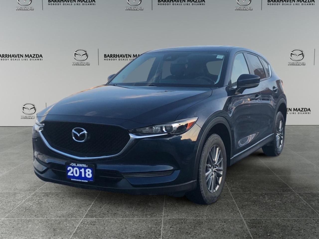 The 2018 Mazda CX-5 GS in a sophisticated gray color and equipped with an intelligent AWD drivetrain offers impeccable handling, making it ideal for navigating diverse Canadian landscapes. This SUV stands as a testament to Mazdas commitment to blending function with style, showcased through its carefully sculpted lines and robust alloy wheels. Step inside to find an interior that exemplifies comfort and modernity. The GS trim comes fitted with sumptuous heated front seats and a leather-wrapped steering wheel, ensuring that every drive is as comfortable as it is stylish. Smart device integration and power features like power seats and windows bring convenience to your fingertips, enhancing your driving experience. Staying connected and safe is effortless with advanced technology options like Bluetooth connectivity and a crisp backup camera that provide peace of mind. The vehicle includes thoughtful safety features such as lane assist and brake assist, designed to offer you an extra layer of protection on the road. This SUV is an excellent choice for families and individuals who prioritize versatility and reliability in their vehicle. Whether youre commuting to work or embarking on weekend adventures, the CX-5 promises to keep you comfortable and secure. Contact our dealership today to learn more and arrange a test drive!