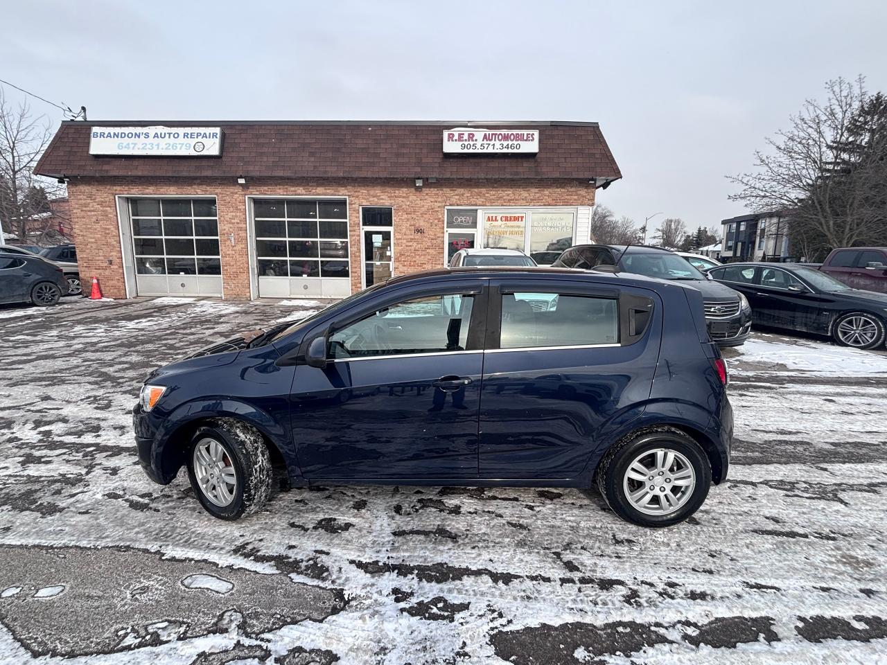 <p>Looking for a stylish and efficient ride that wont break the bank? Check out this eye-catching 2015 Chevrolet Sonic, available now at R.E.R. Automobiles Ltd. This compact hatchback is perfect for navigating city streets while offering surprising space and versatility. Its sleek blue exterior and sophisticated black interior make a statement wherever you go. With only 144,750 km on the odometer, this Sonic is ready to provide you with years of reliable service.</p><p>Under the hood, youll find a responsive 4-cylinder engine paired with a smooth automatic transmission, making every drive enjoyable. The front-wheel-drive configuration ensures confident handling in various road conditions. Dont miss the opportunity to own this well-maintained and stylish Chevrolet Sonic.</p><p>Here are a few of the features that make this 2015 Chevrolet Sonic stand out:</p><ul><li><strong>Super Clean:</strong> This Sonic has been meticulously maintained!</li><li><strong>Fuel-Efficient Performance:</strong> The 4-cylinder engine is perfect for saving you money at the pump.</li><li><strong>Hatchback Versatility:</strong> With its hatchback design, youll have ample cargo space for all your adventures.</li><li><strong>Automatic Transmission:</strong> Enjoy effortless driving with the smooth-shifting automatic transmission.</li><li><strong>Stylish Design:</strong> The blue exterior and black interior create a sophisticated and modern look.</li></ul><p><strong><em>Powered by AutoIntelligence&trade;</em></strong> Vehicle information has been generated using artificial intelligence and is provided for informational purposes only. While efforts are made to ensure accuracy, please confirm all details directly with the dealer.</p><pre style=overflow-wrap: break-word; white-space: pre-wrap;>This vehicle is certified,  serviced & oil changed. Financing available O.A.C  <br><br><br>R.E.R. Automobiles Ltd. is a family owned business, established in 1994.<br><br>Referrals built us, reliability keep us serving you.<br><br>R.E.R. Automobiles Ltd. ... We Care.</pre>