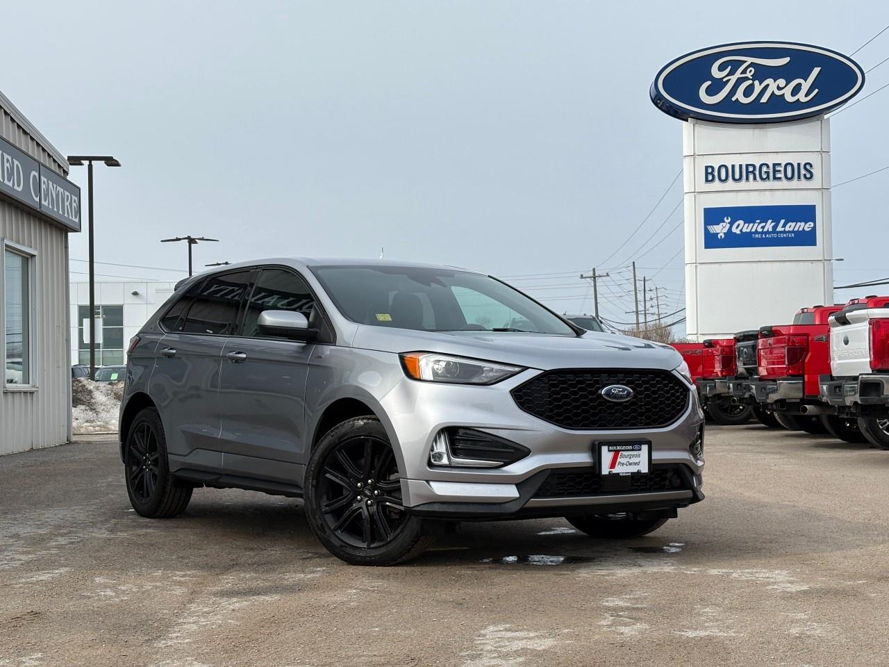 <p>Experience the thrill of driving with the 2022 Ford Edge ST Line AWD in a striking Silver finish. This SUV offers you an unparalleled all-wheel-drive experience, ensuring impressive handling and traction on both city streets and rugged roads.</p> <p>The exterior of this Ford Edge complements its dynamic performance with stylish alloy wheels and sleek lines. Inside, the Black interior is enhanced with premium touches like heated front seats and a leather-wrapped steering wheel, providing a touch of elegance and comfort. You'll enjoy the convenience of features such as keyless entry and power seats.</p> <p>This SUV is packed with advanced technology, featuring a user-friendly backup camera, bluetooth connectivity, and smart device integration for all your entertainment needs. Safety is paramount with features like lane assist, brake assist, and parking sensors, offering peace of mind during every drive.</p> <p>If you are an adventurous driver or a family looking for a reliable and safe vehicle with cutting-edge technology, the 2022 Ford Edge ST Line AWD is the ideal choice. Contact our dealership today to learn more and take this exceptional vehicle for a test drive.</p>